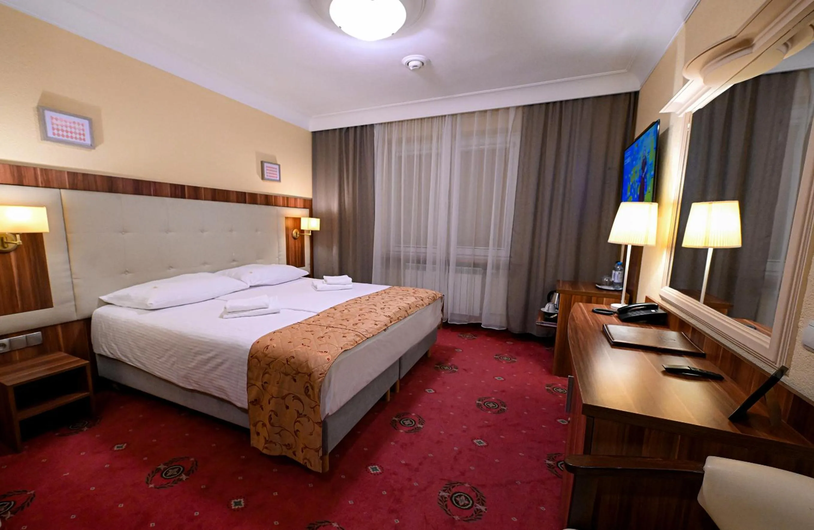 Bed in Cumulus Hotel