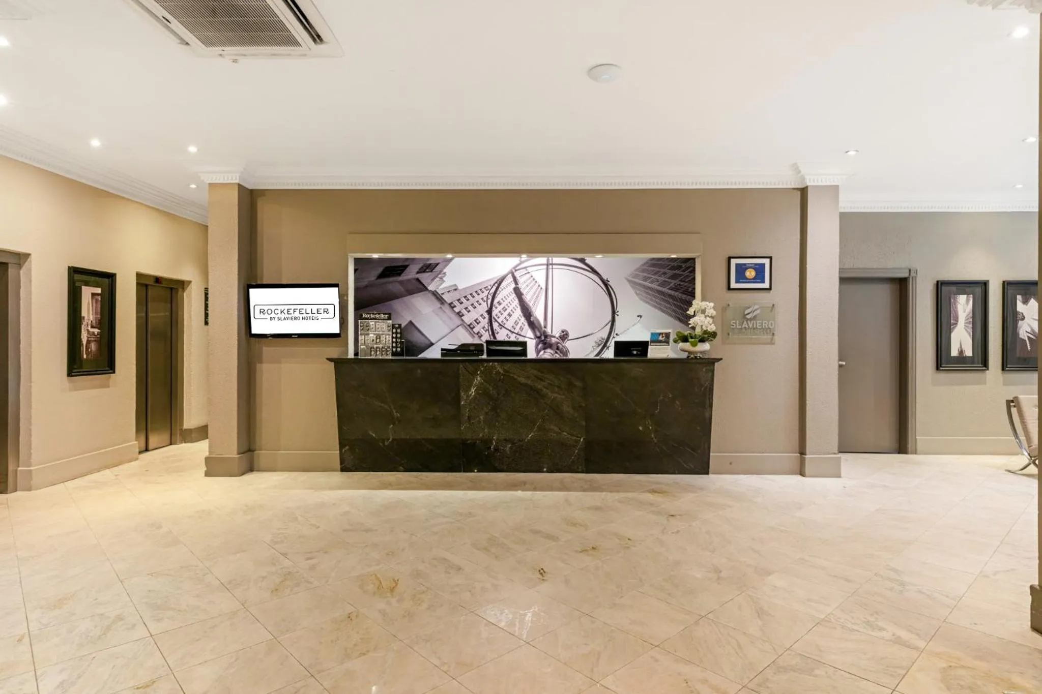 Lobby or reception in Rockefeller by Slaviero Hotéis