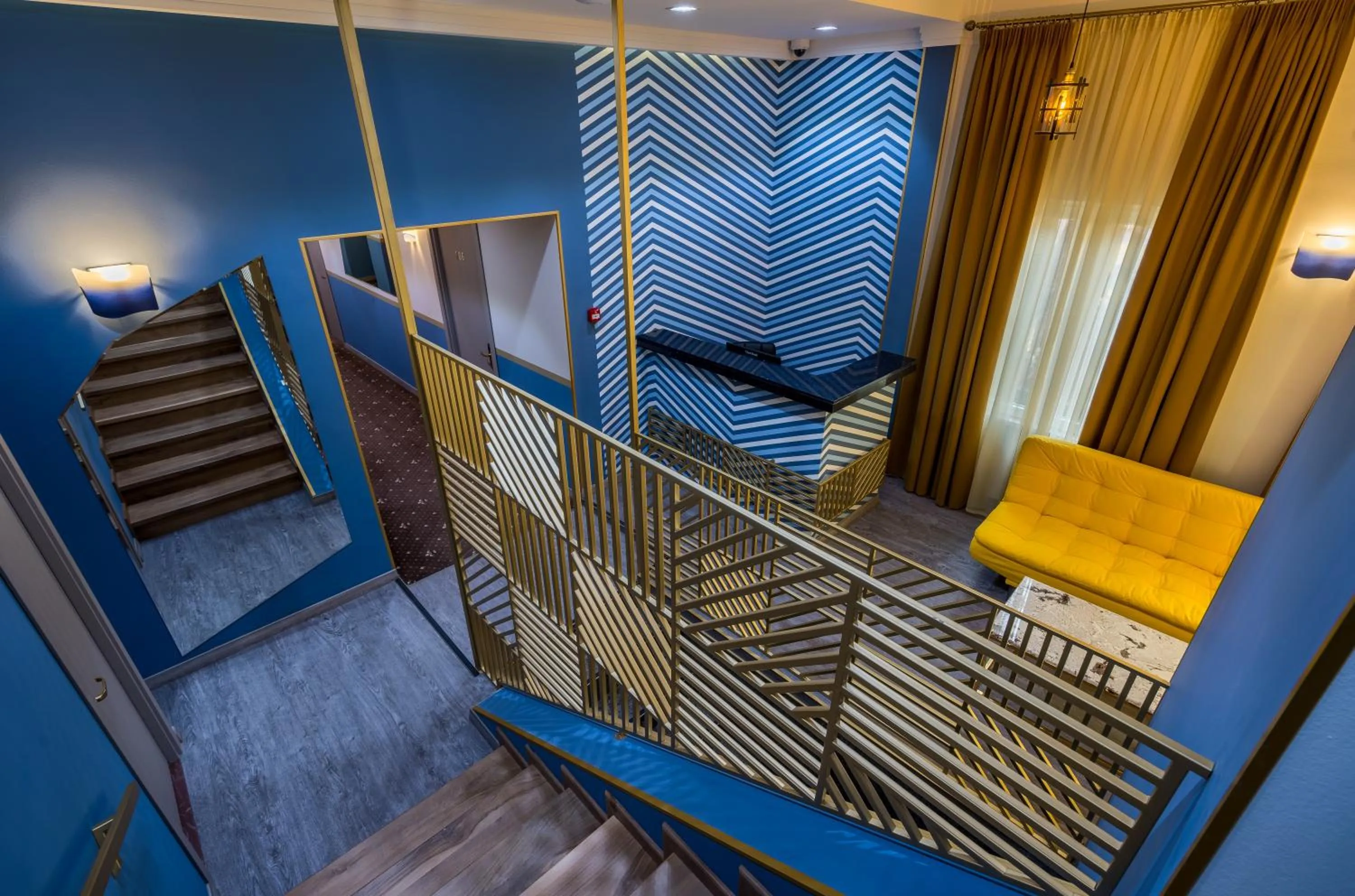 Communal lounge/ TV room in Gladius Inn Boutique Hotel by DNT Group