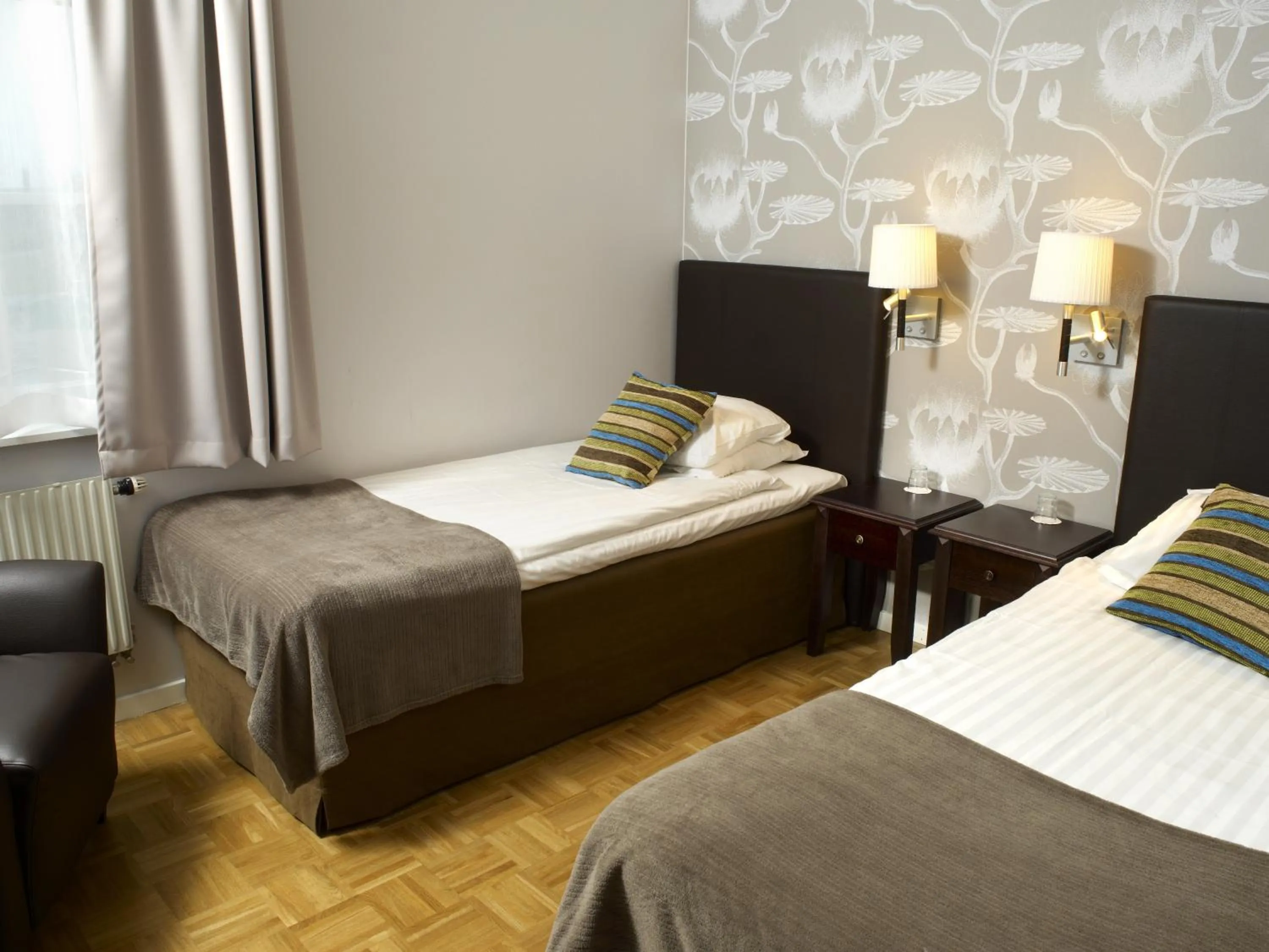 Bedroom, Bed in Vimmerby Stadshotell, WorldHotels Crafted