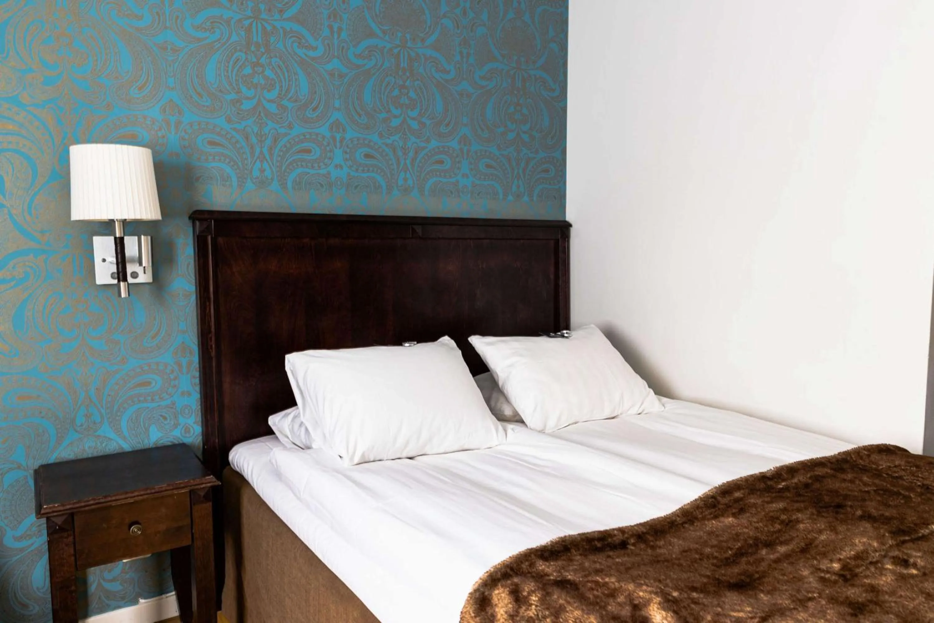 Bedroom, Bed in Vimmerby Stadshotell, WorldHotels Crafted