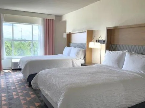 Photo of the whole room, Bed in Holiday Inn & Suites - Fayetteville W-Fort Bragg Area by IHG