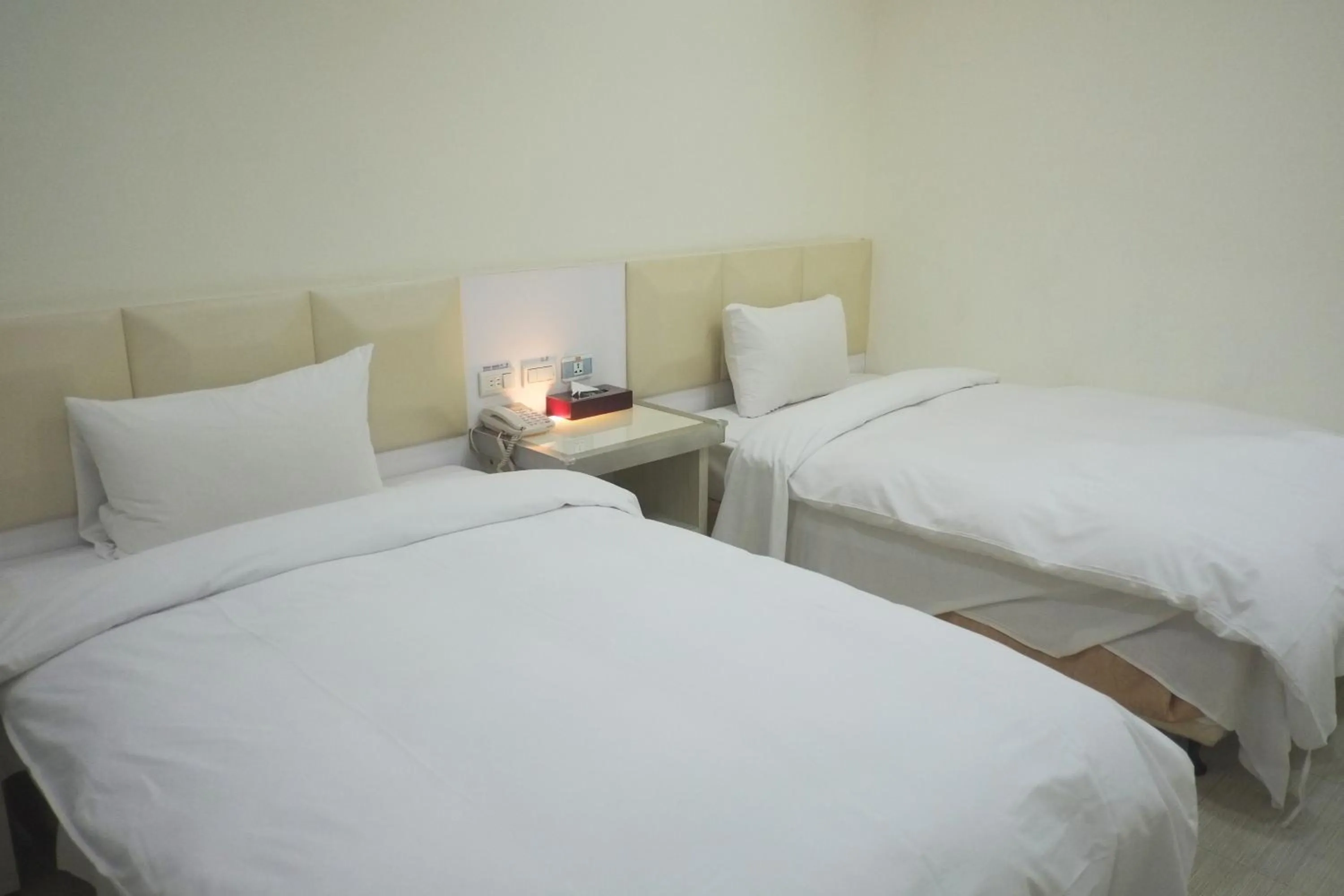 Bed in 柜富賓王旅店-台北館 Giant Rich King Plaza Hotel