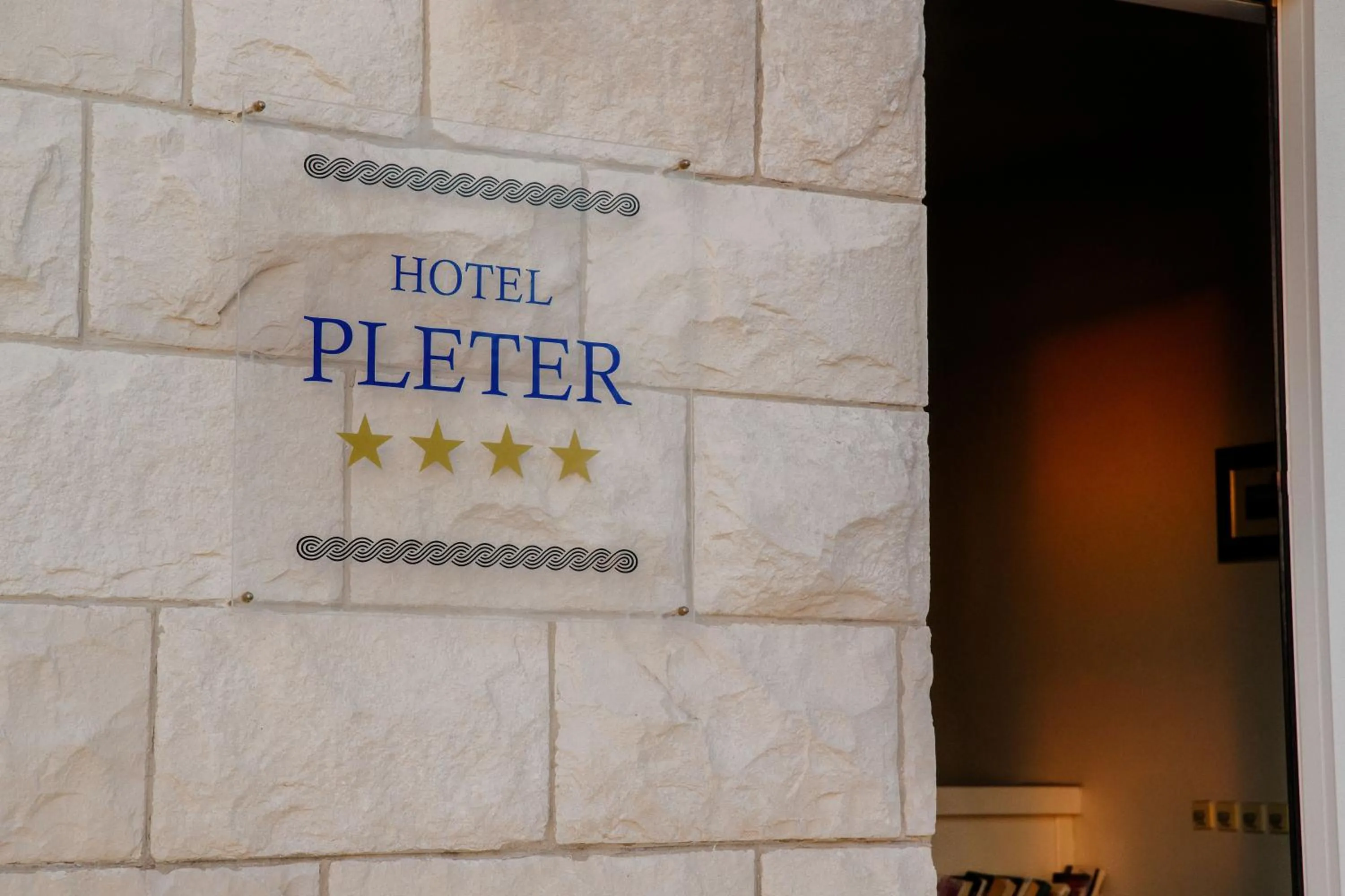 Property logo or sign in Hotel Pleter