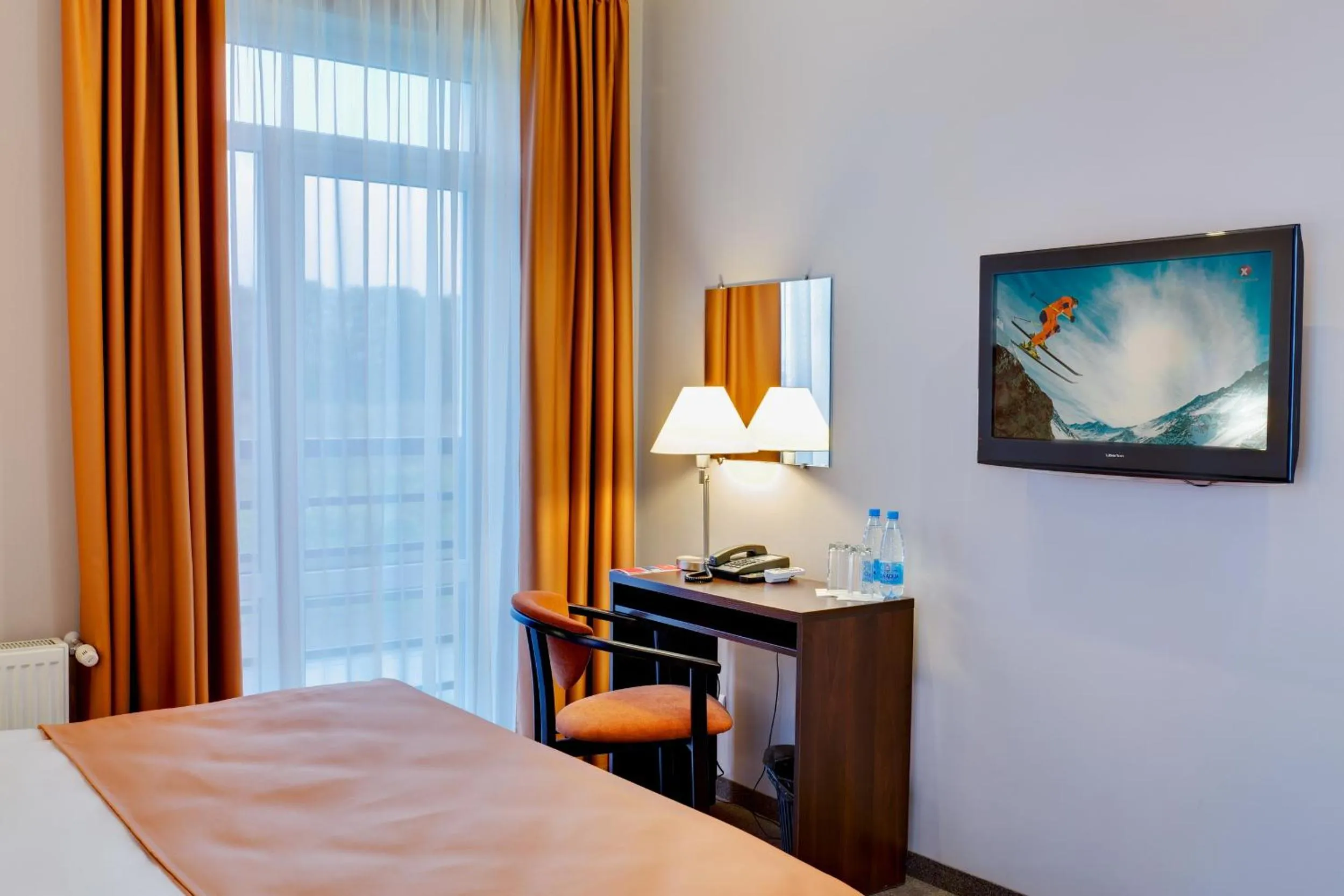 Seating area, Bed in Lviv Ramada Hotel