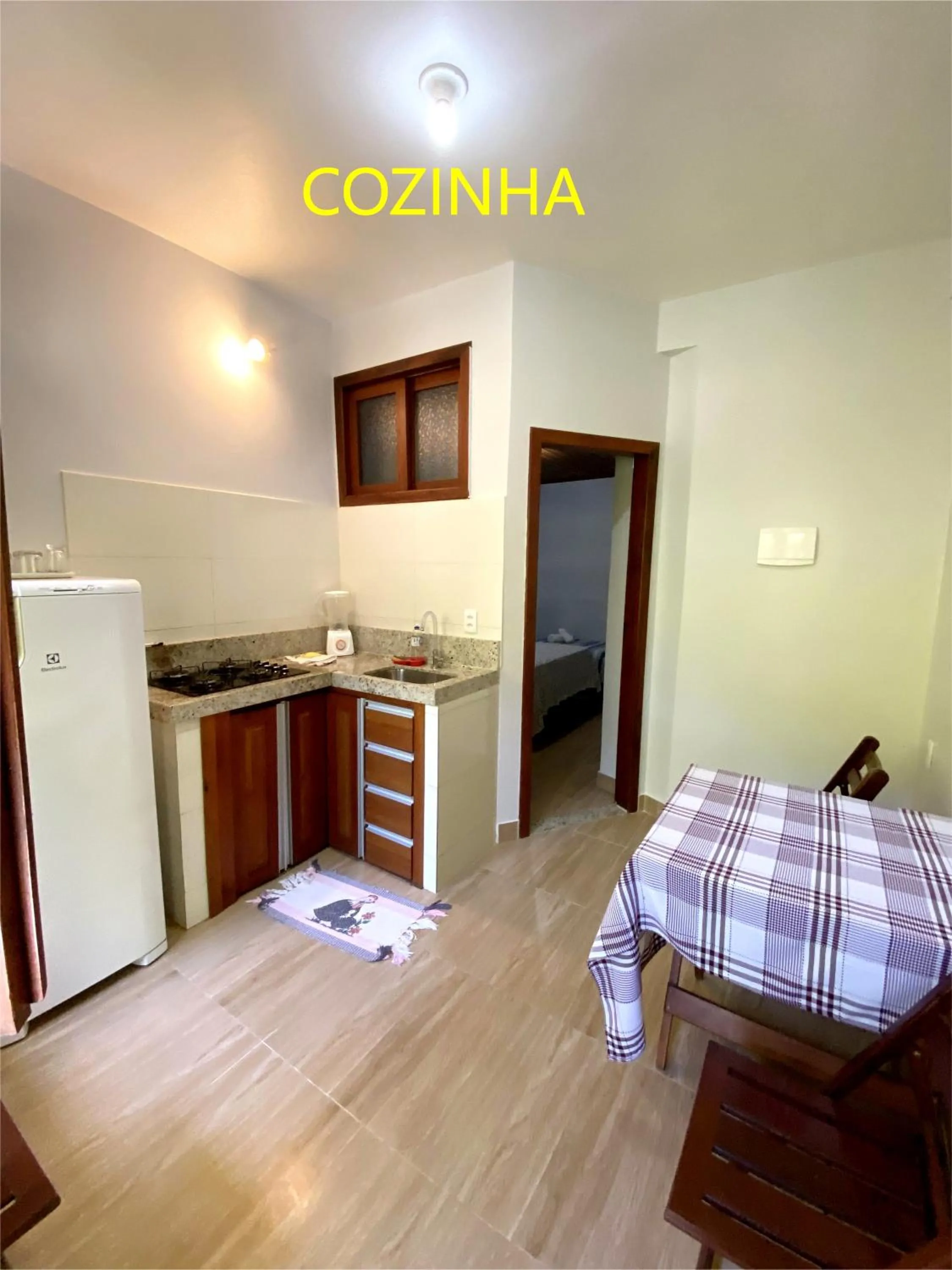 Kitchen or kitchenette, Bed in Pousada Lagoa Flat