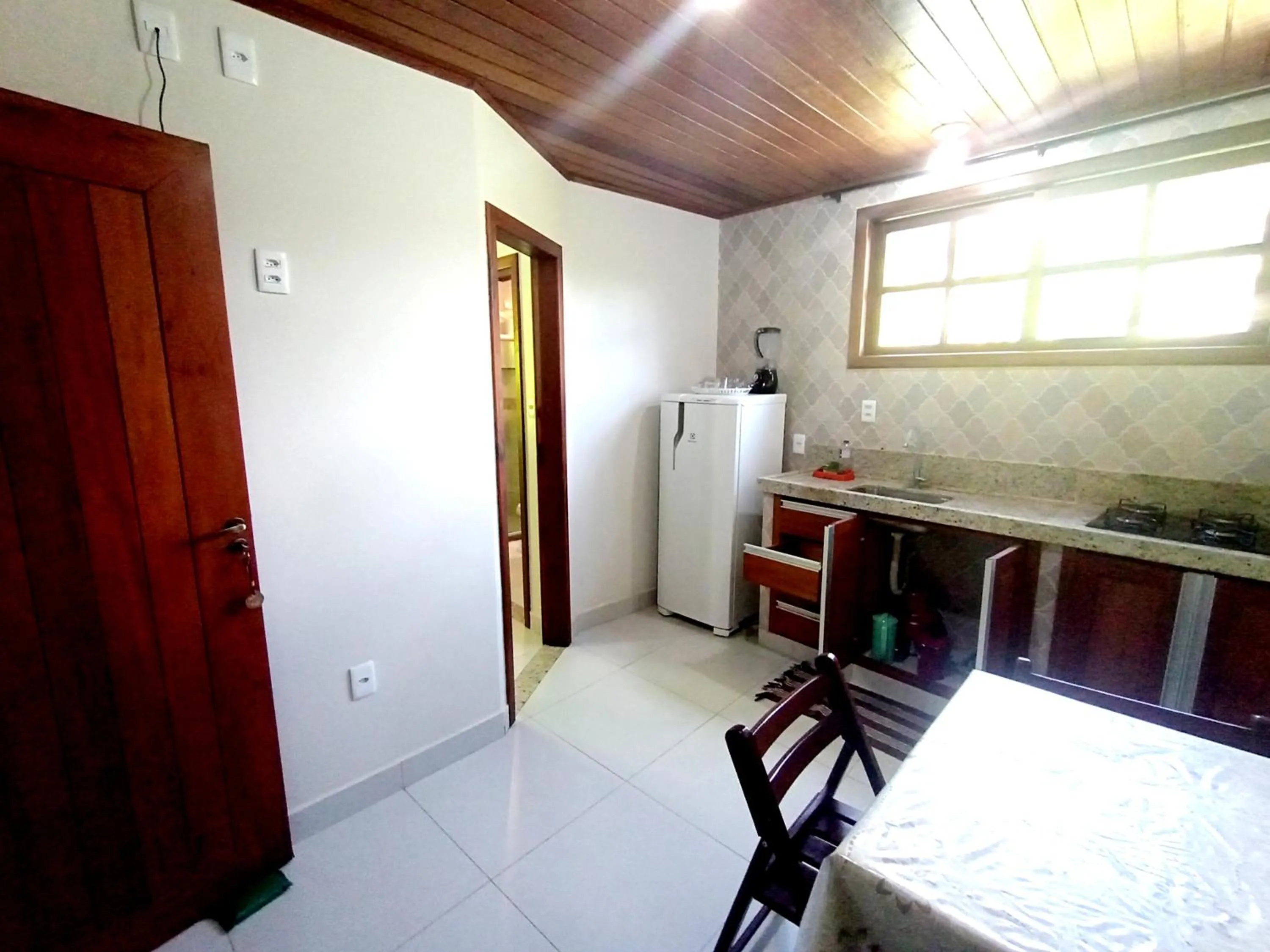Kitchen or kitchenette, Bed in Pousada Lagoa Flat