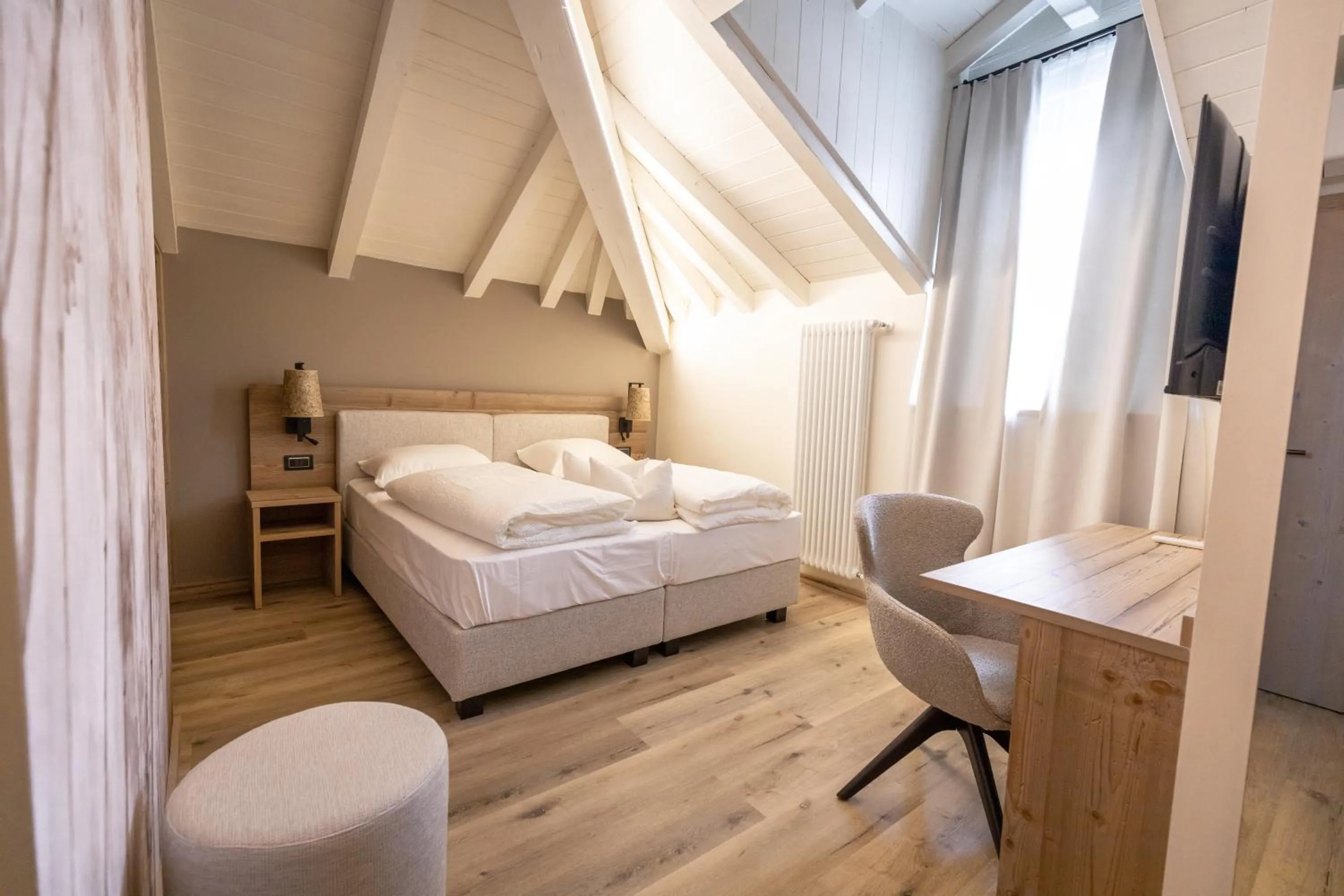 Bed in Hotel Alpenrose Wellness