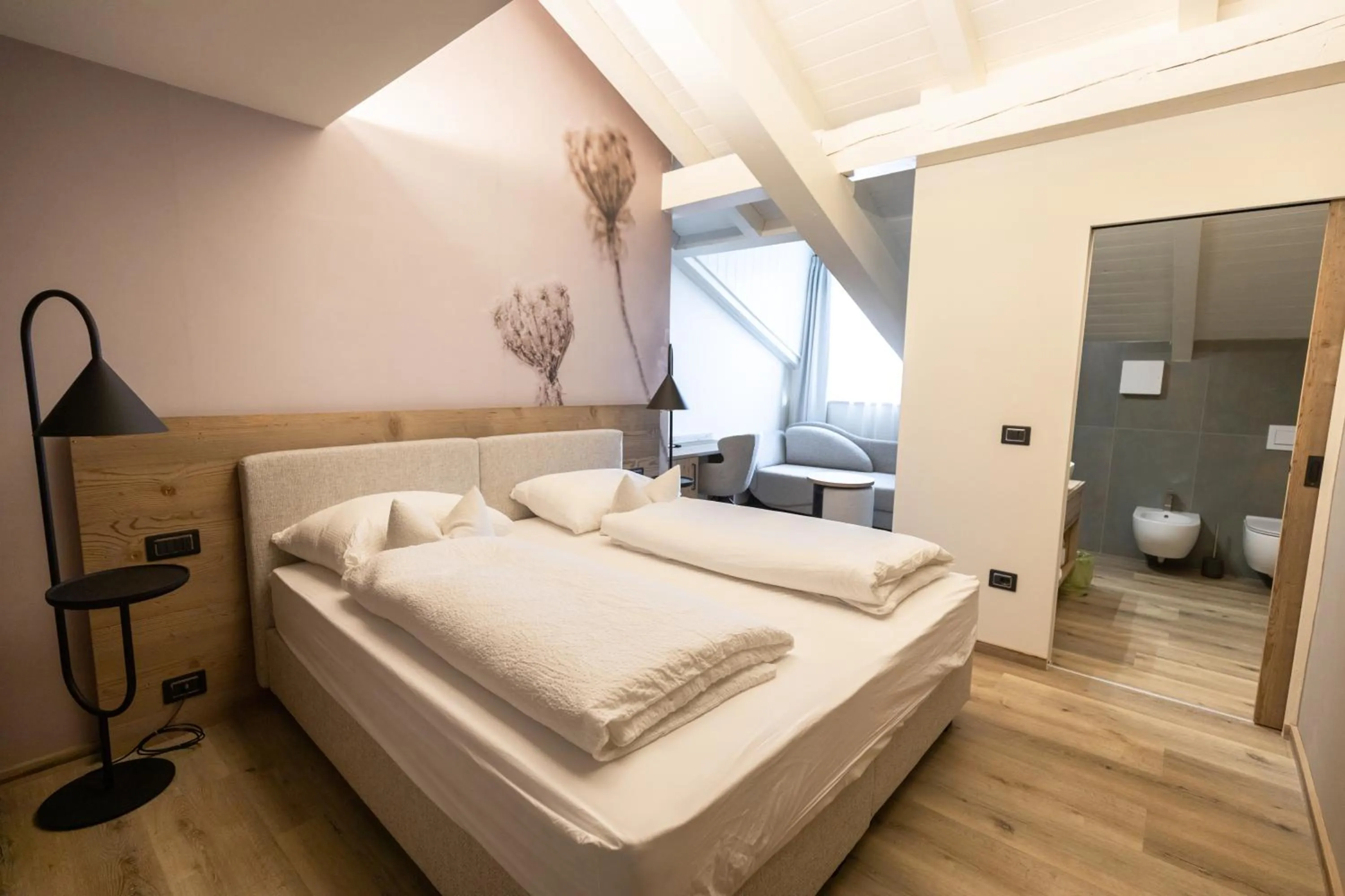 Bed in Hotel Alpenrose Wellness