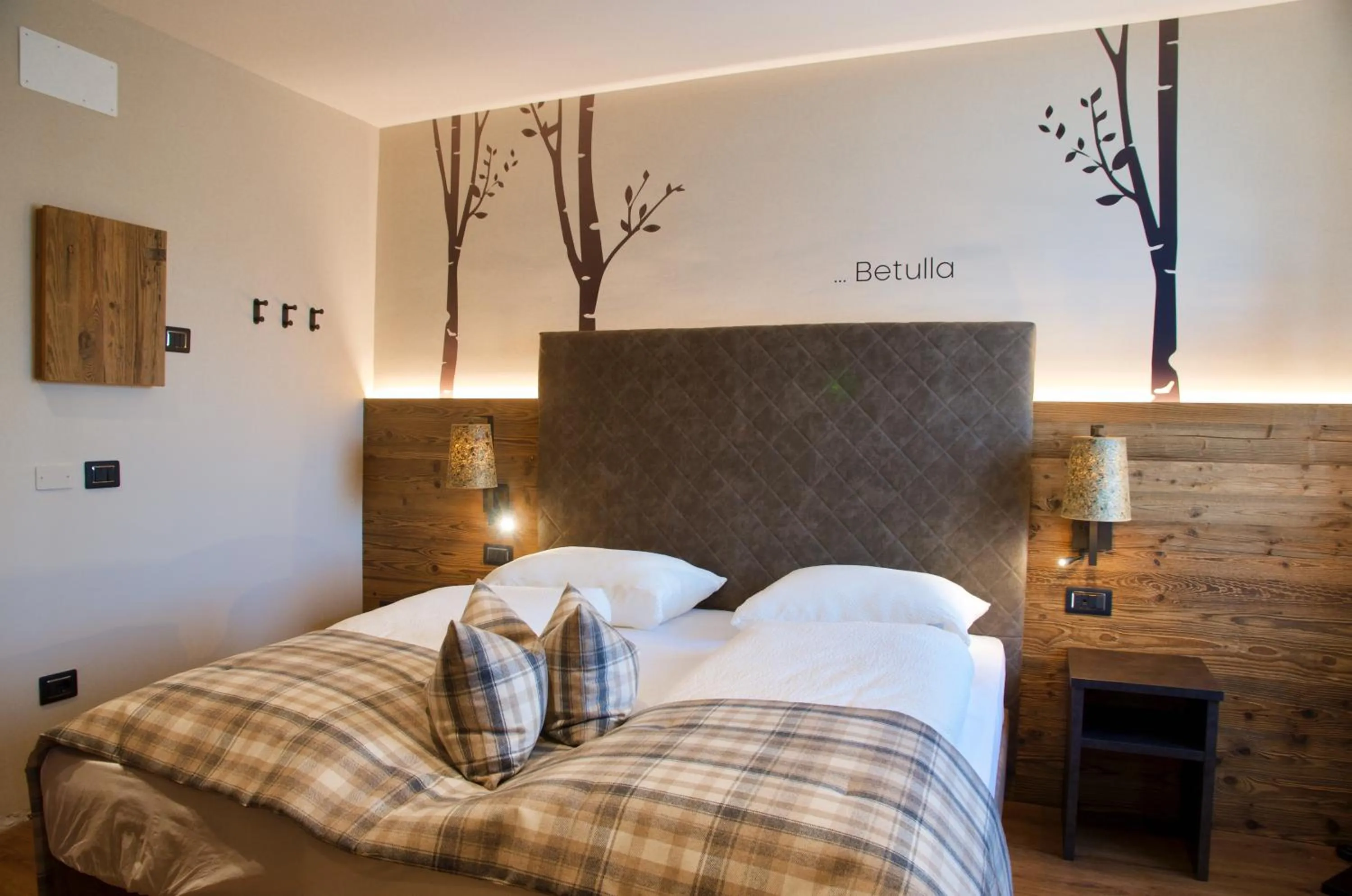 Bed in Hotel Alpenrose Wellness