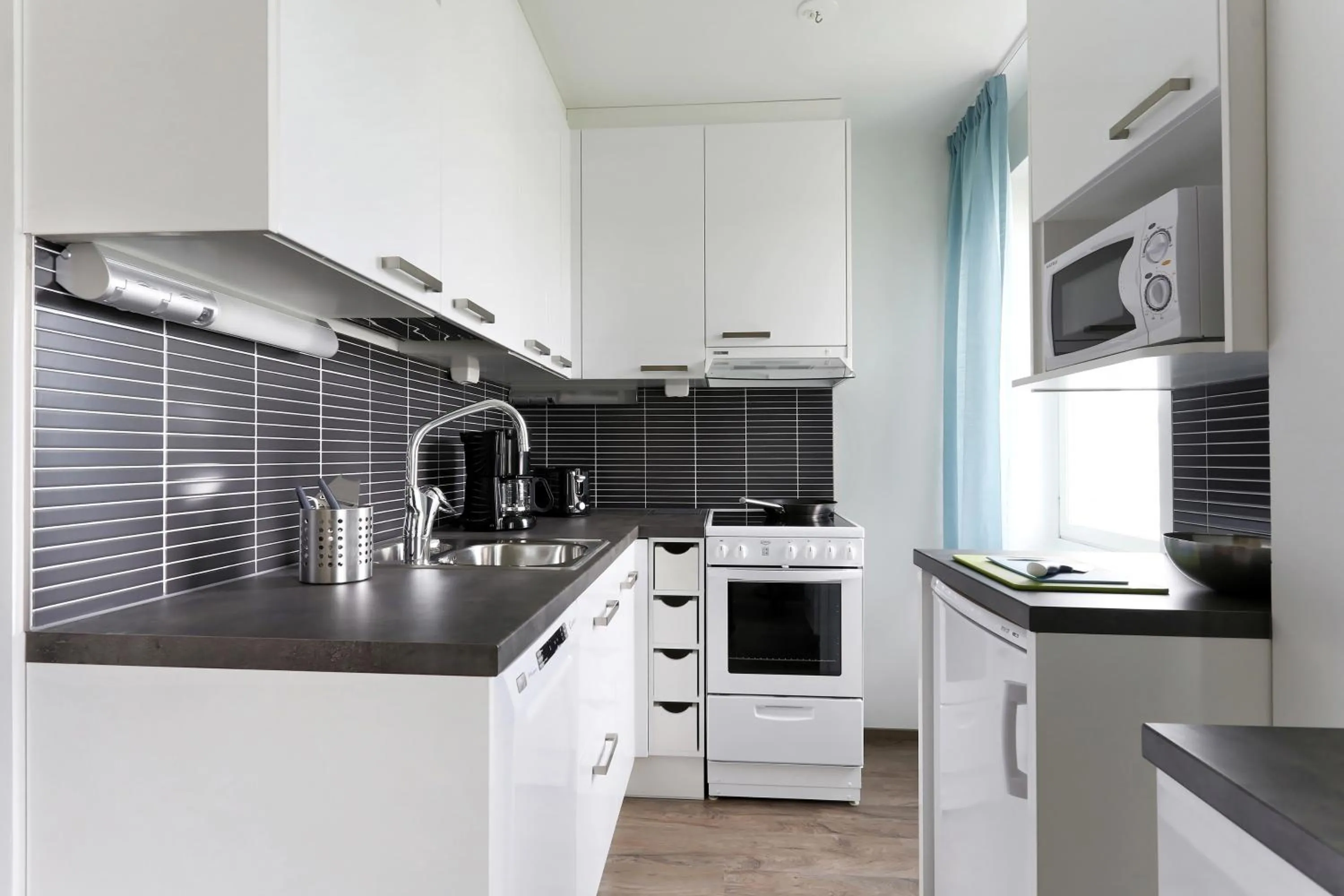 Kitchen or kitchenette in Forenom Serviced Apartments Helsinki Lapinlahdenkatu