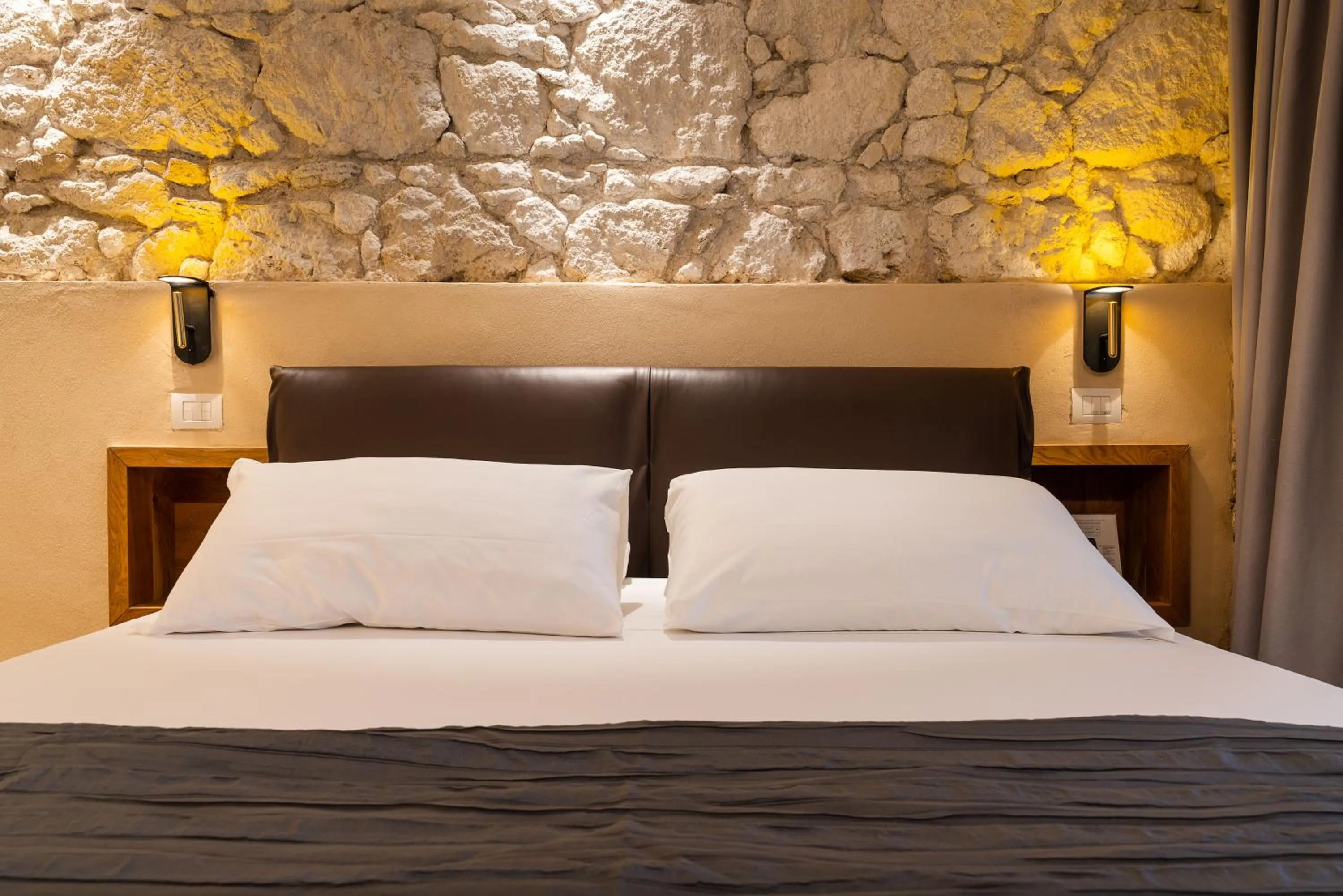 Bed in Re Dionisio Luxury Suites