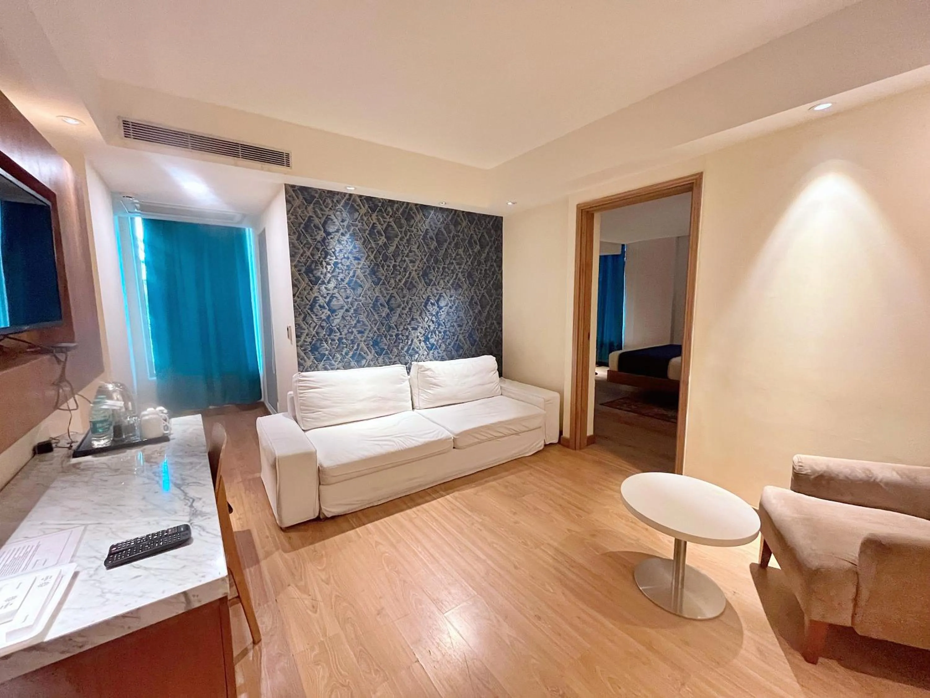 Living room, Bed in The Orion Plaza - Nehru Place