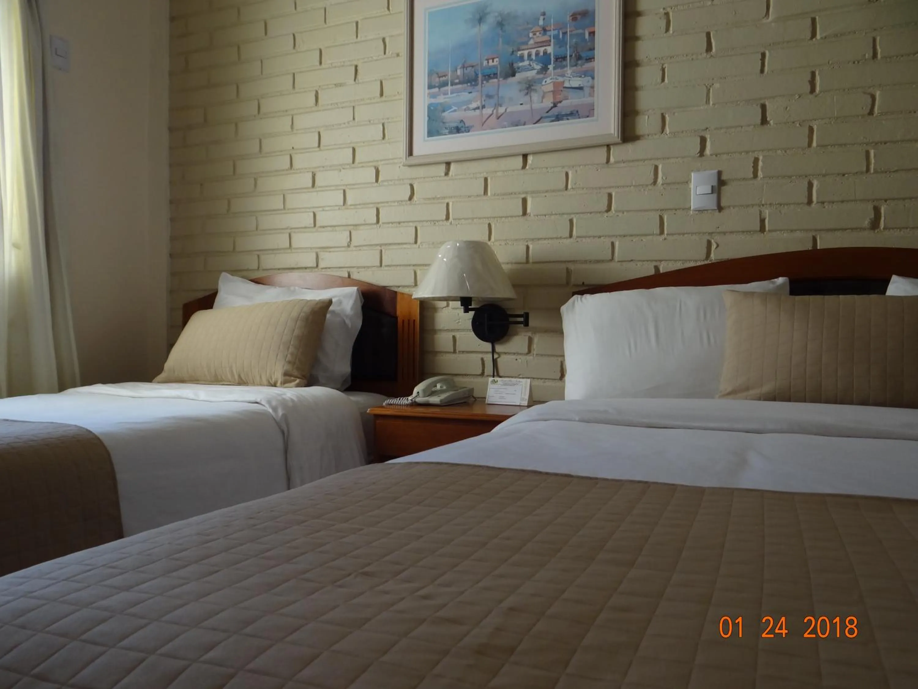 Bed in Hotel Mac Arthur