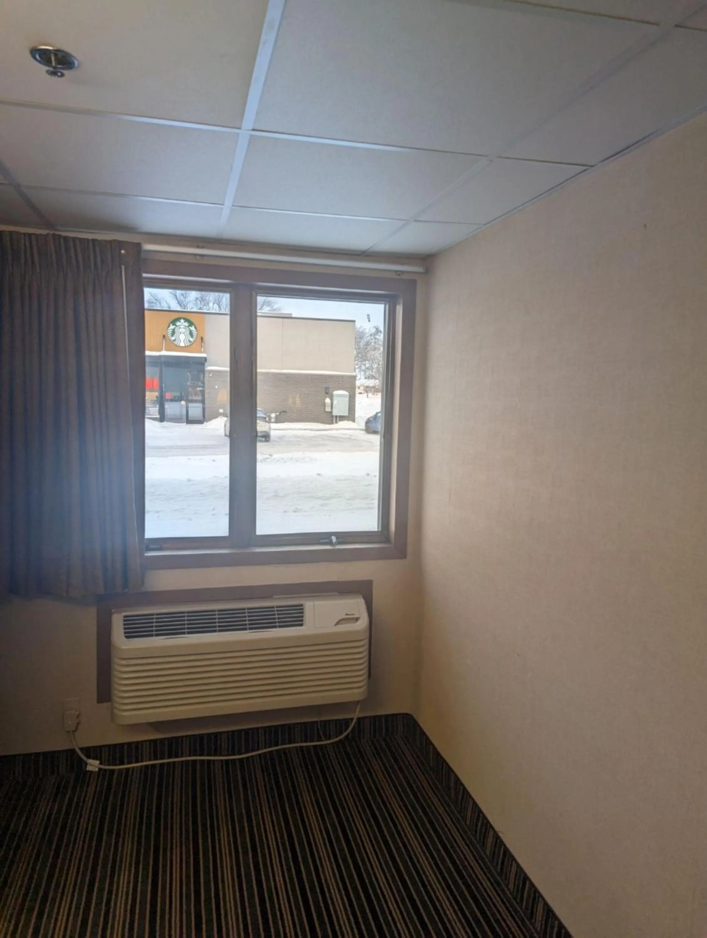 air conditioner, Bed in Woodfield Inn and Suites