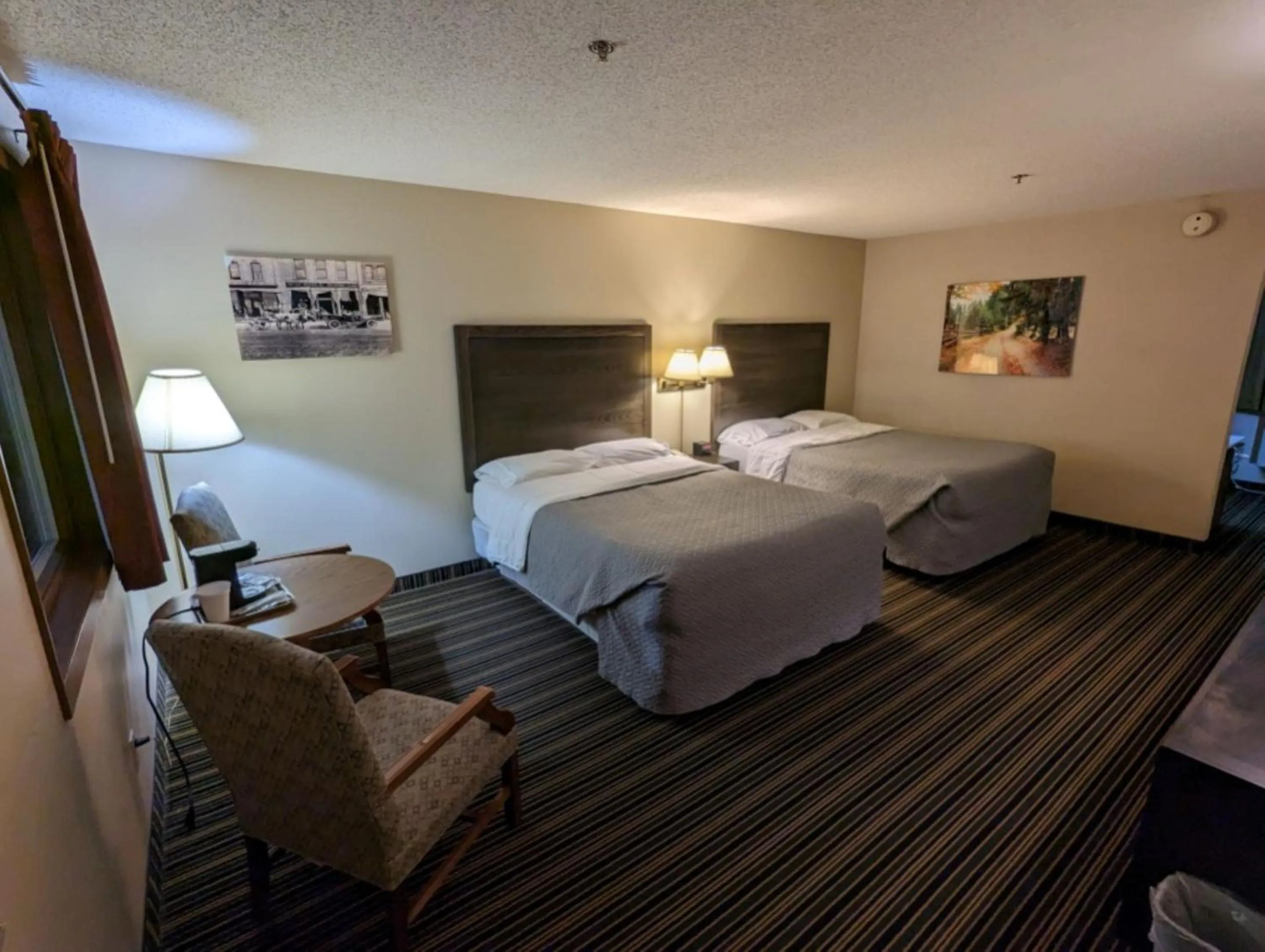 Bed in Woodfield Inn and Suites