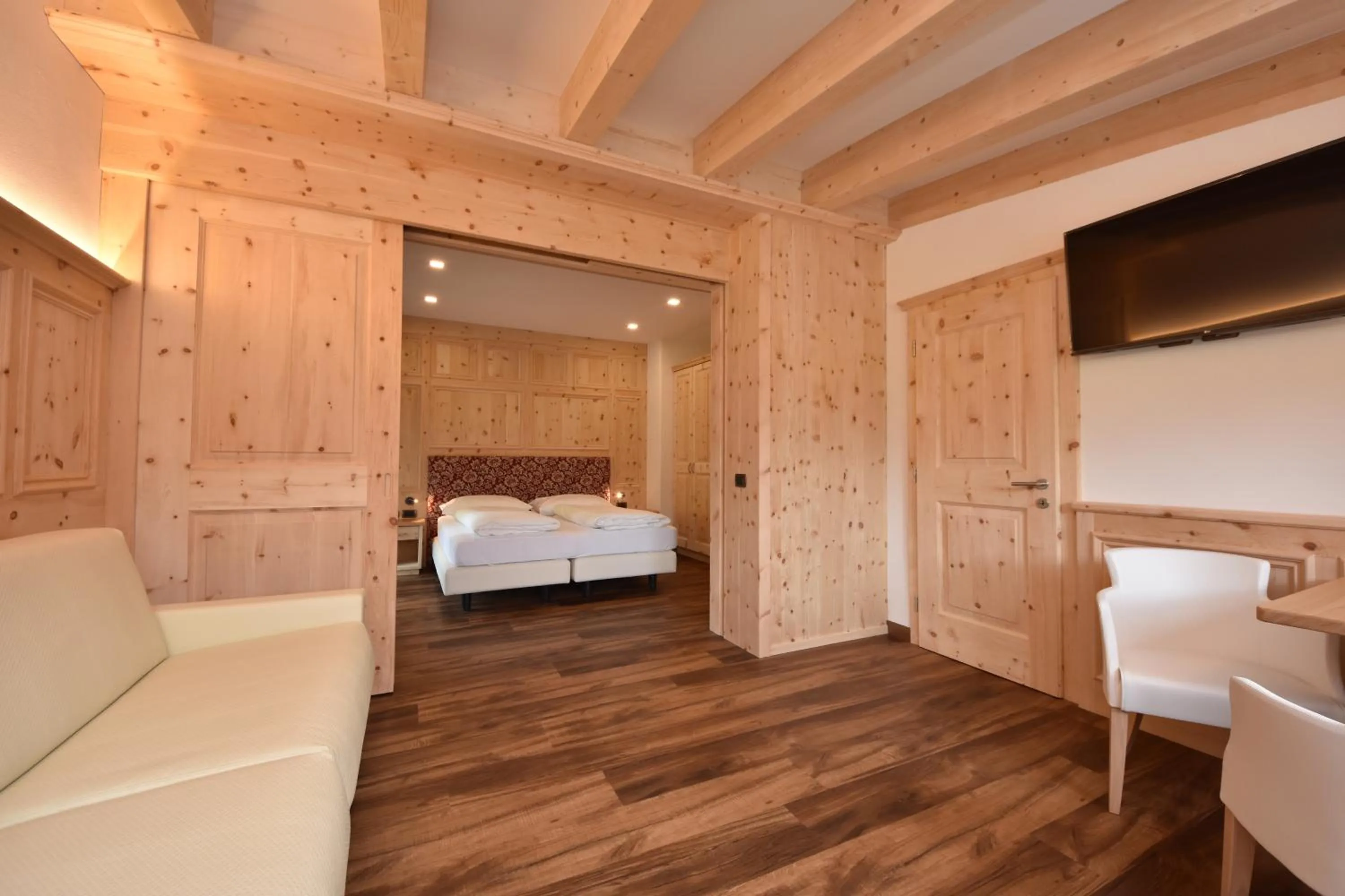 Bed in Belvedere Dolomites Flower Hotel