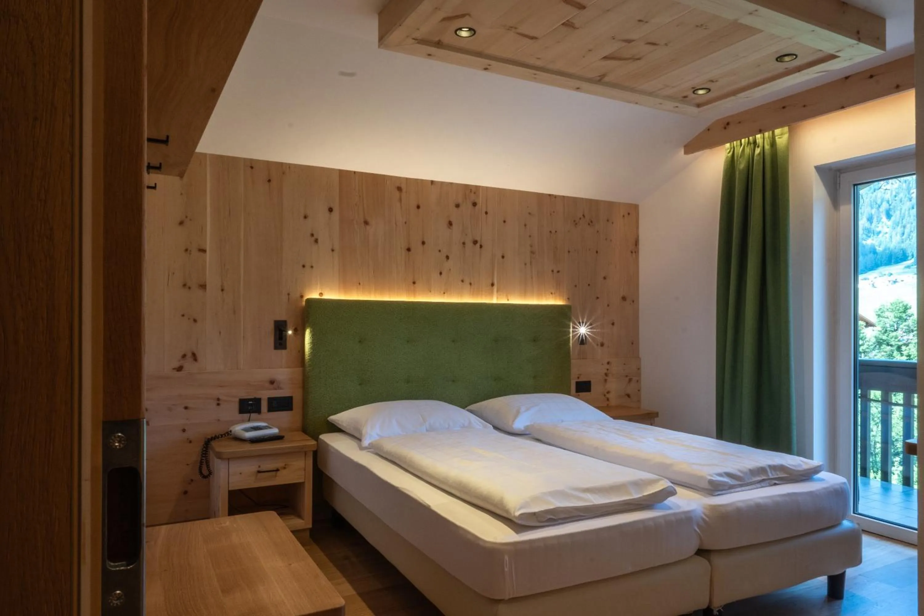 Bed in Belvedere Dolomites Flower Hotel