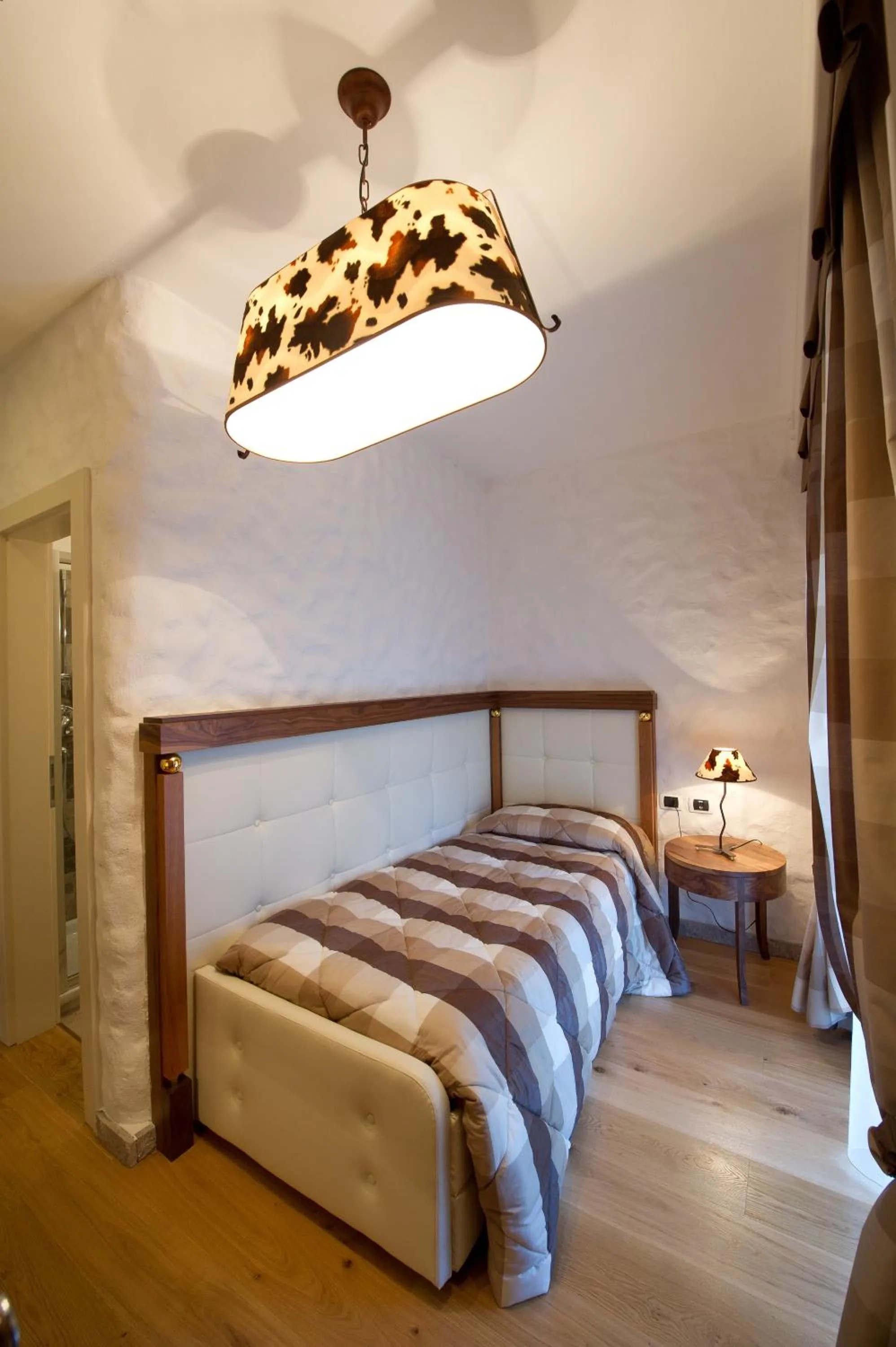 Bed in Belvedere Dolomites Flower Hotel