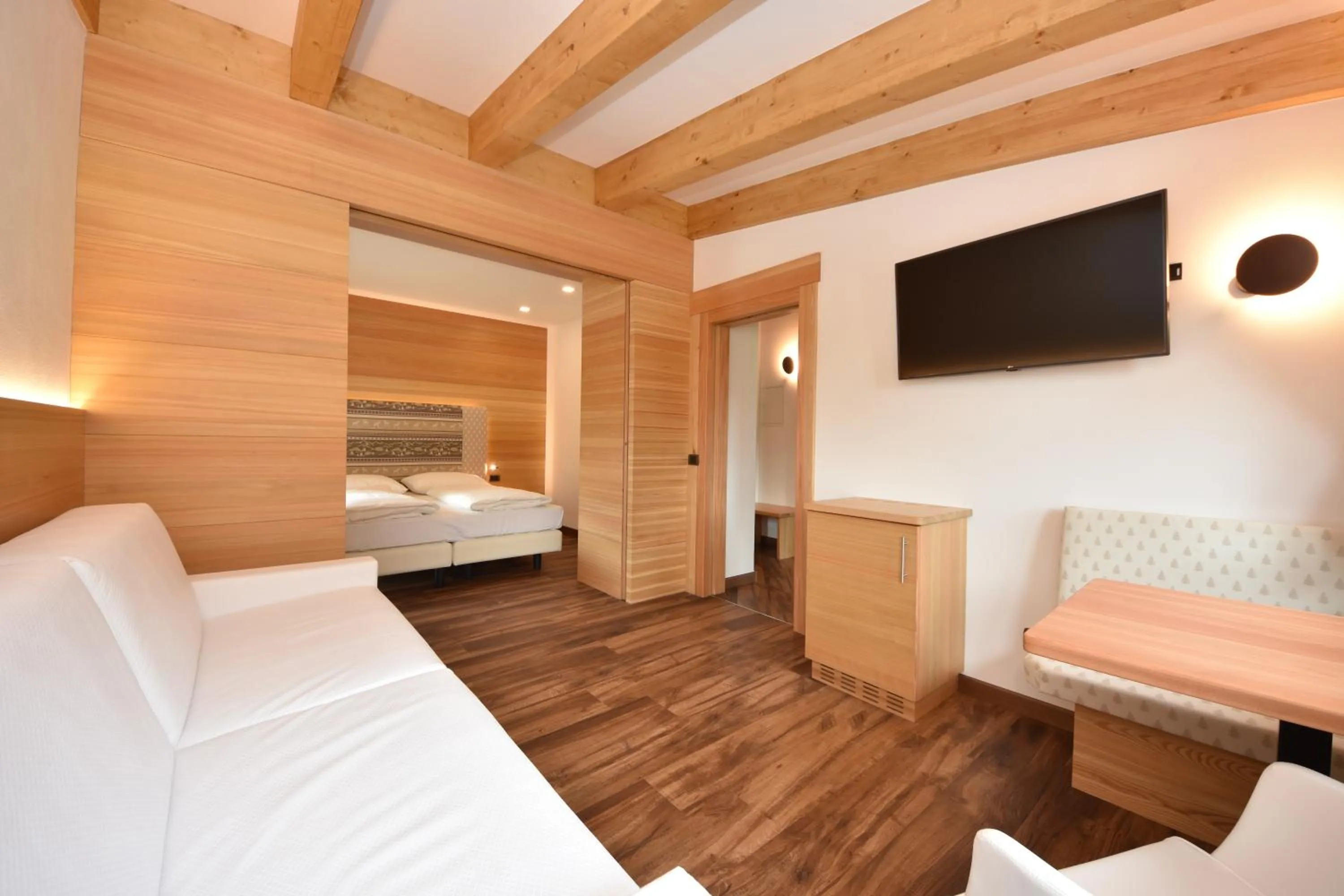 Bed in Belvedere Dolomites Flower Hotel