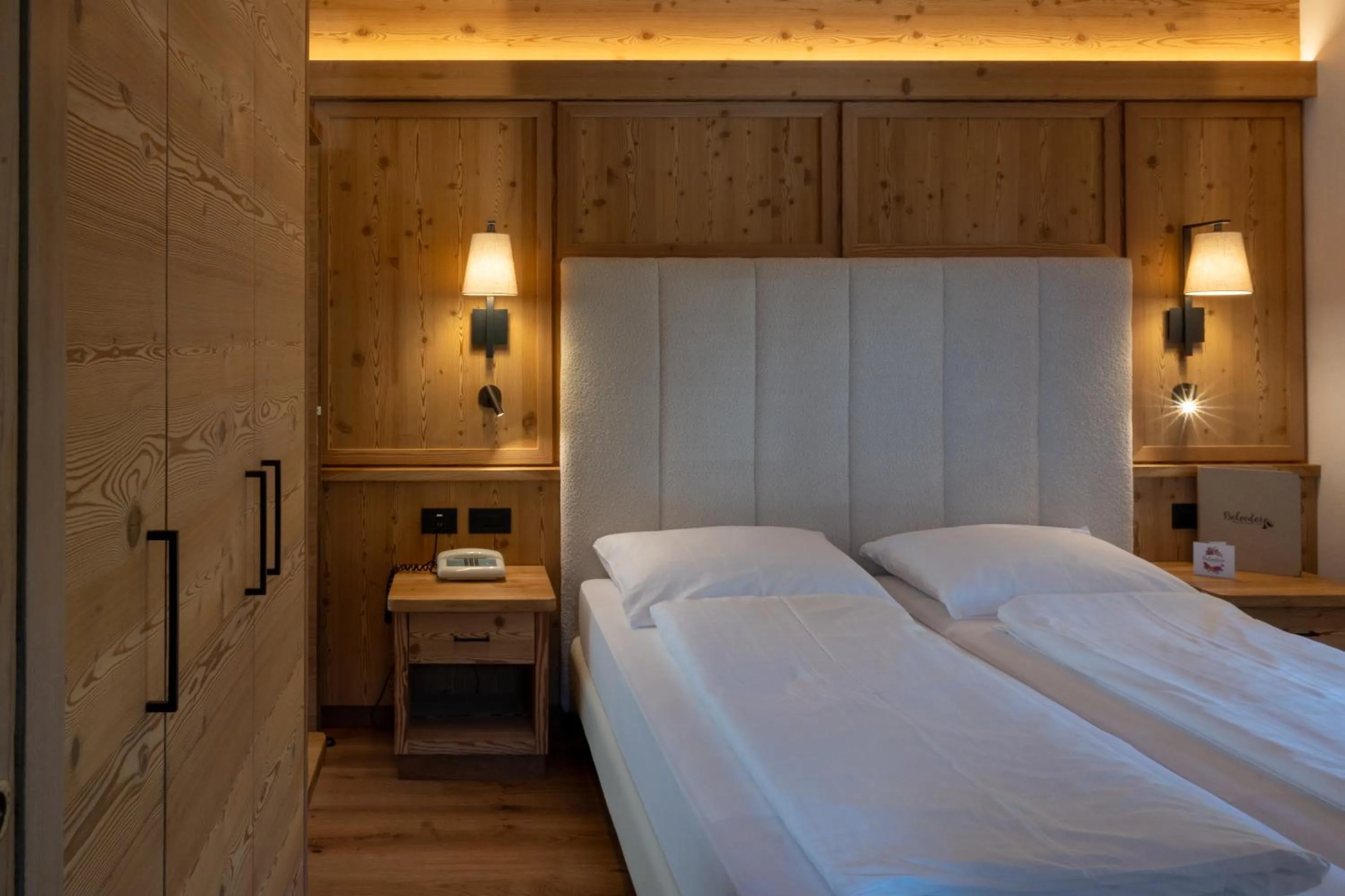 Bed in Belvedere Dolomites Flower Hotel