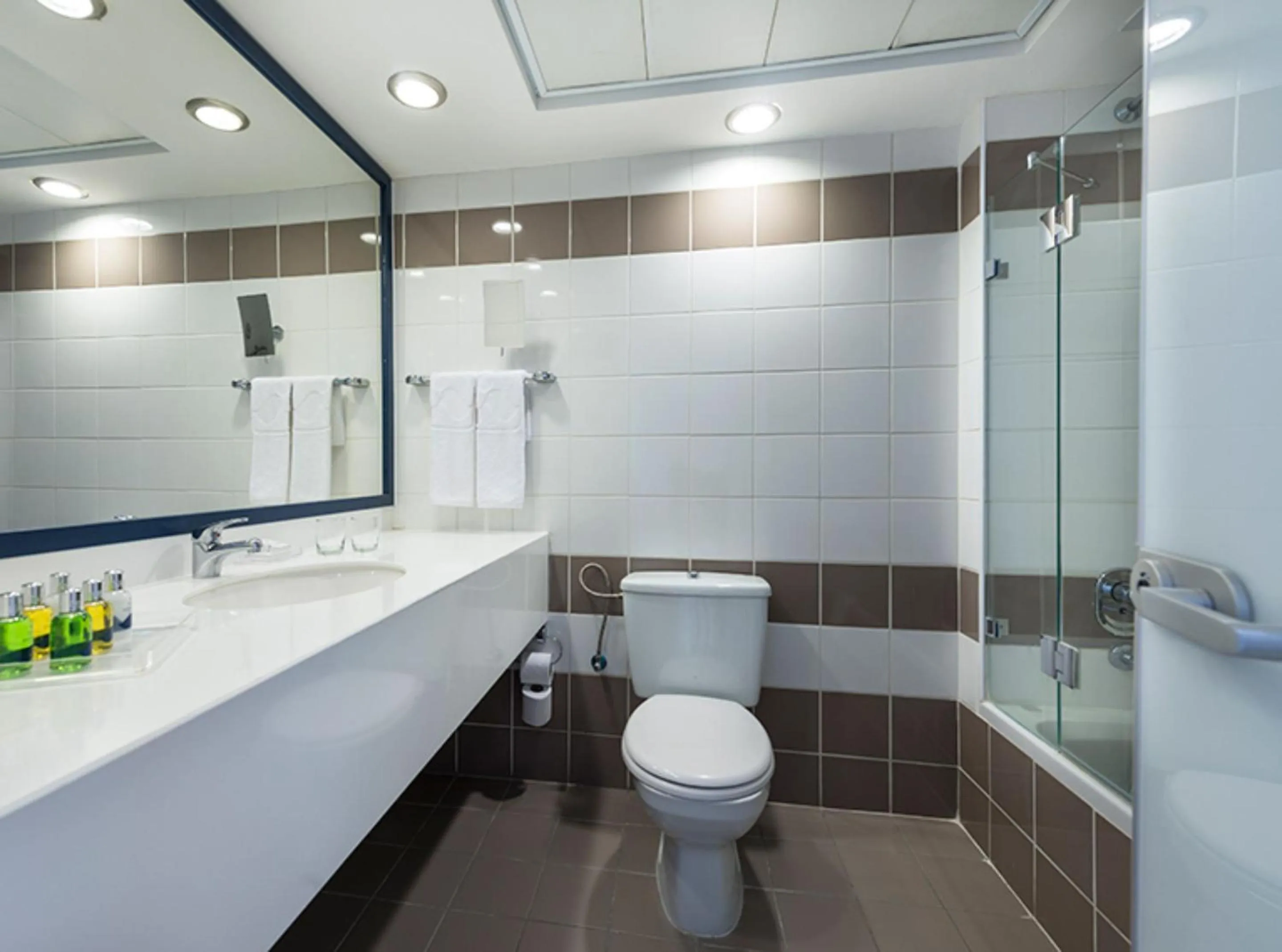 Bathroom in Sport Club by Isrotel Collection