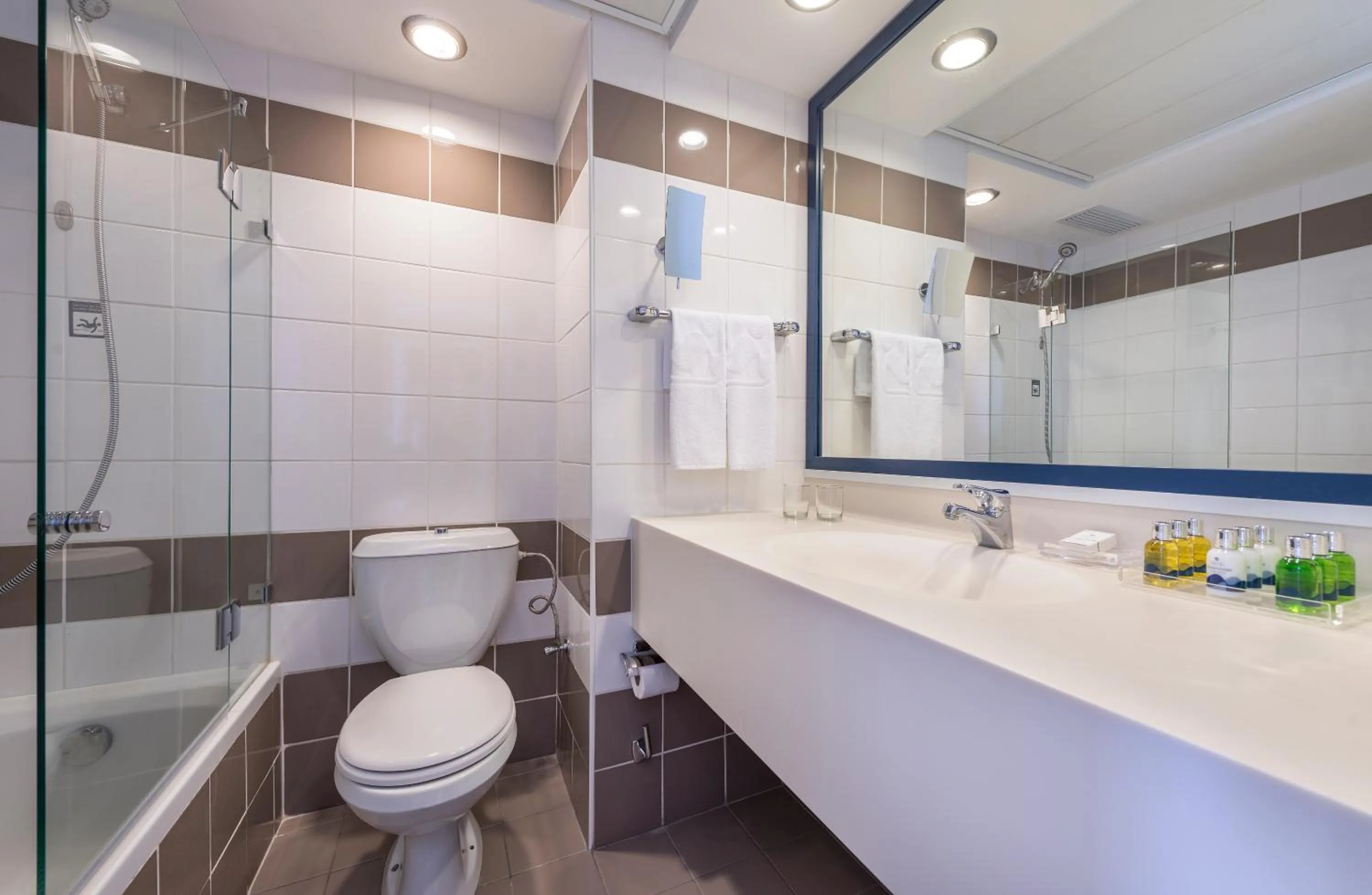 Bathroom in Sport Club by Isrotel Collection