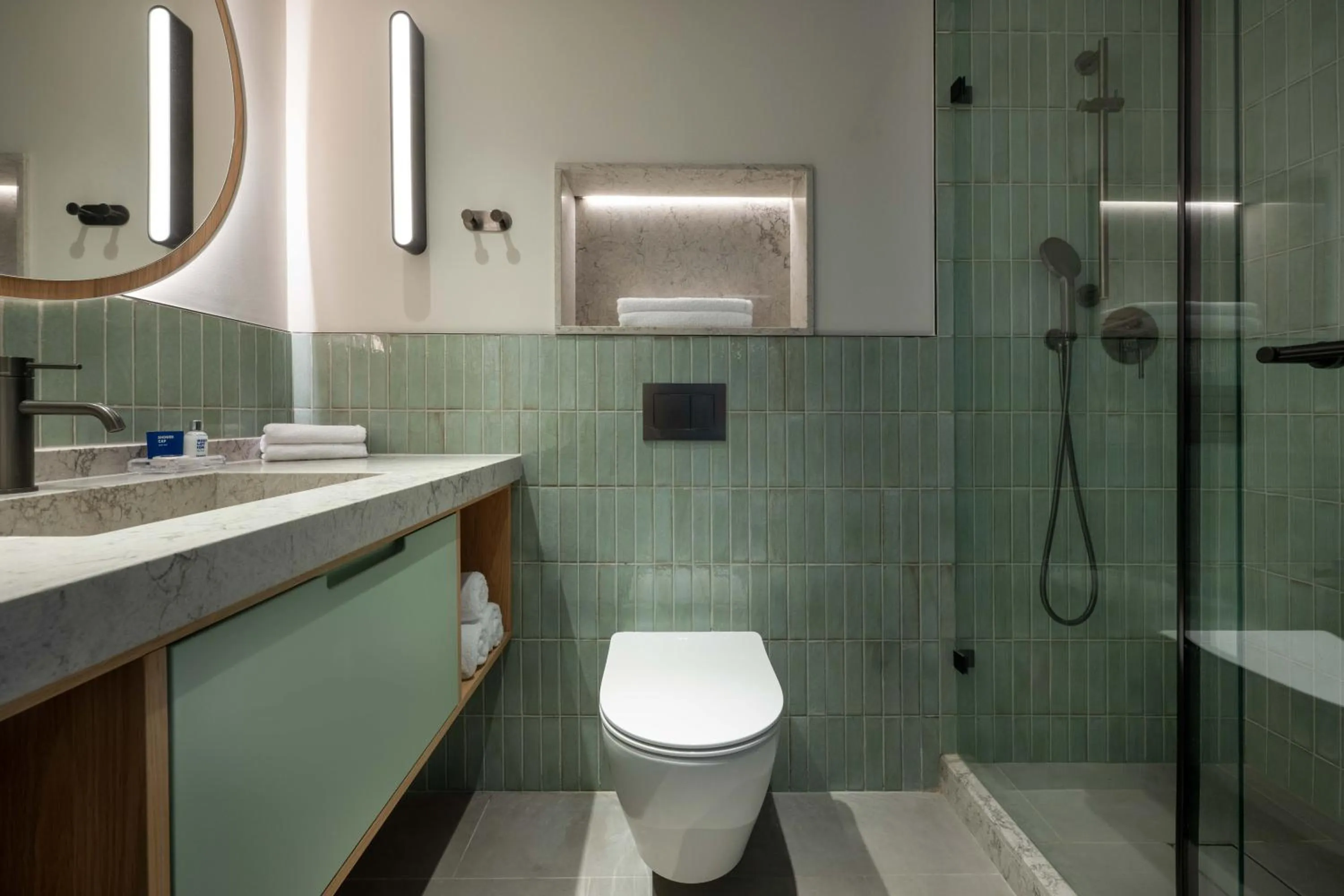 Bathroom in Sport Club by Isrotel Collection