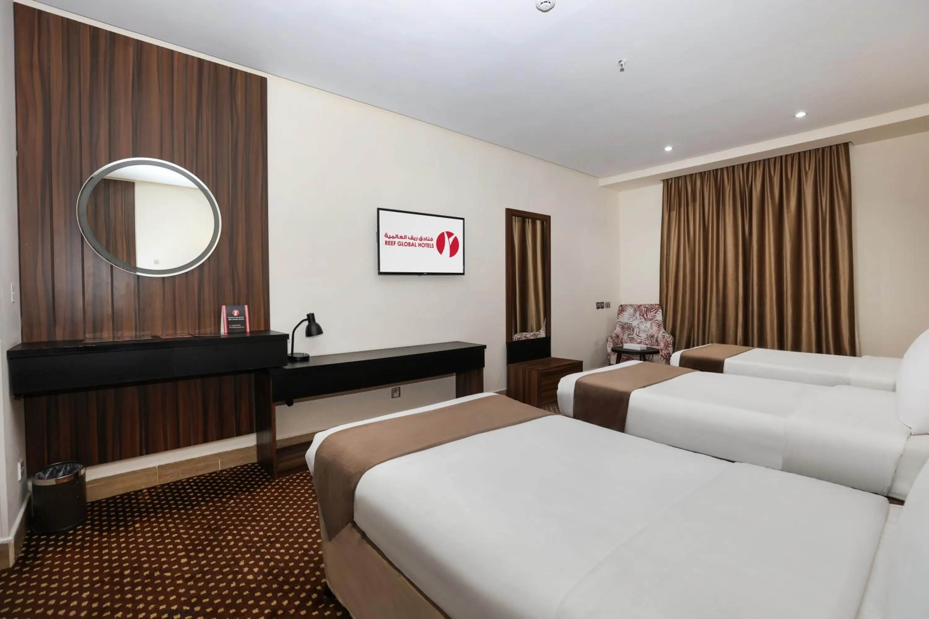 Bed in Reef Global Hotel