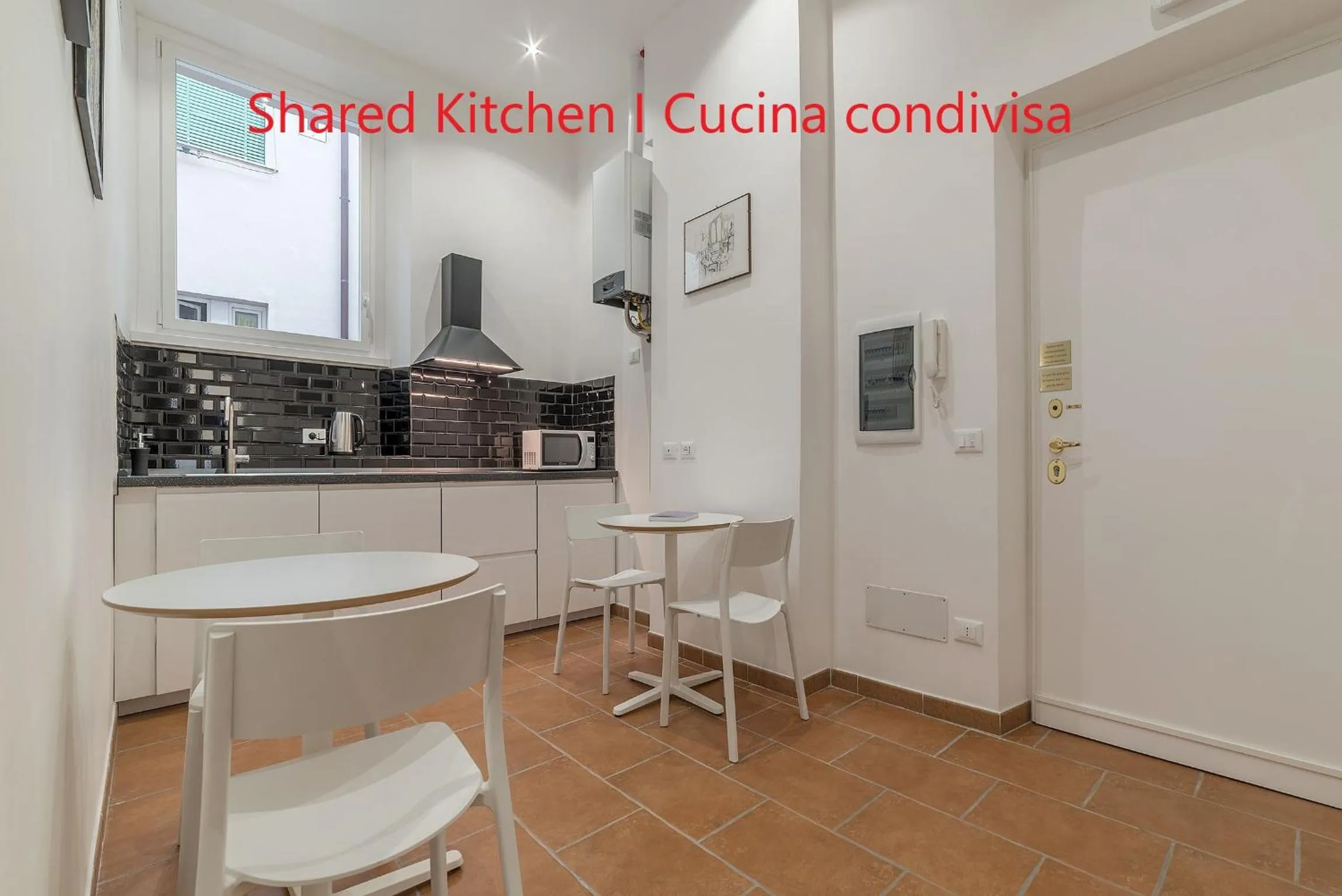 Communal kitchen in Appartamento Via Genova