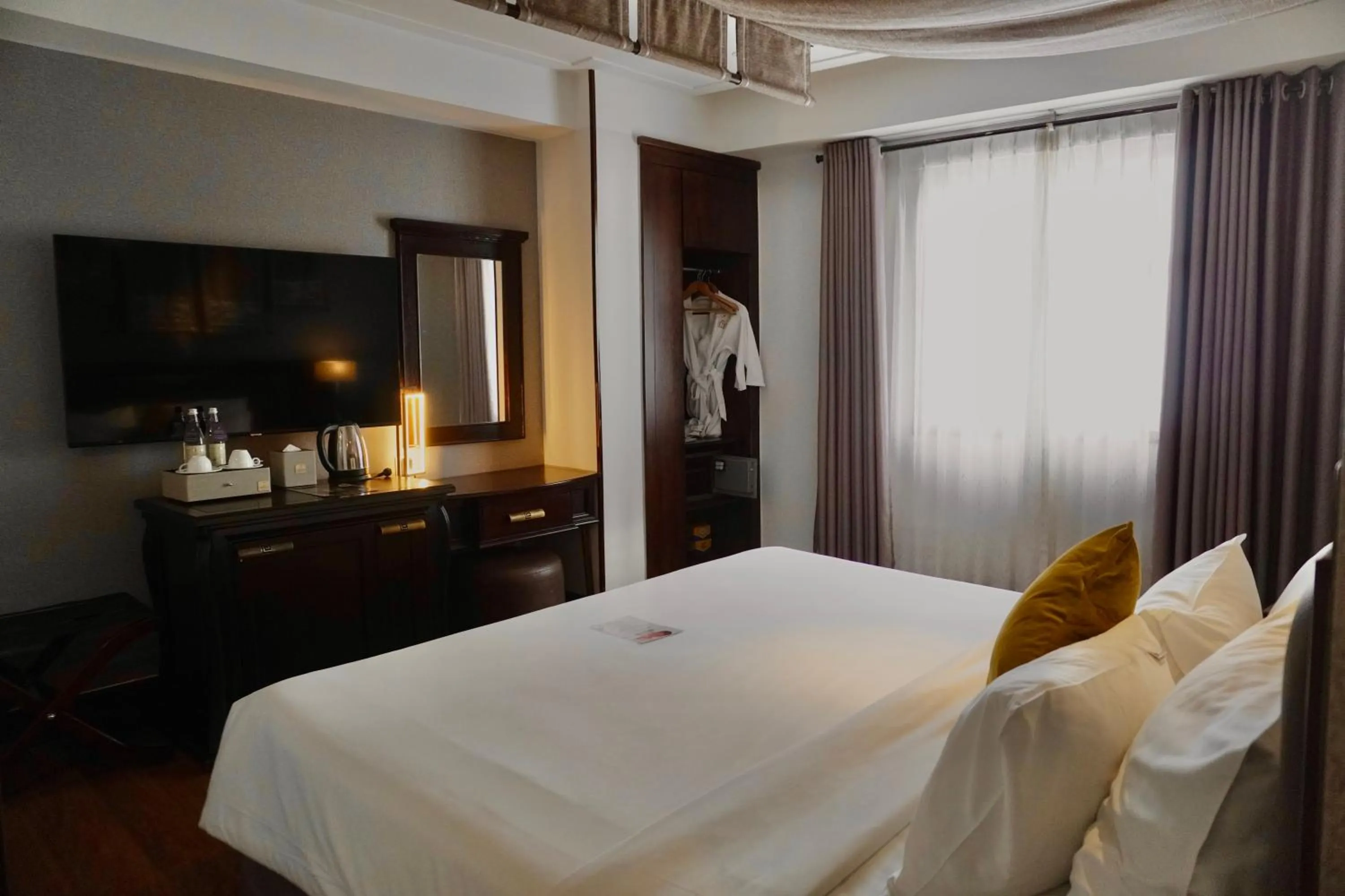 Bed in The Odys Boutique Hotel