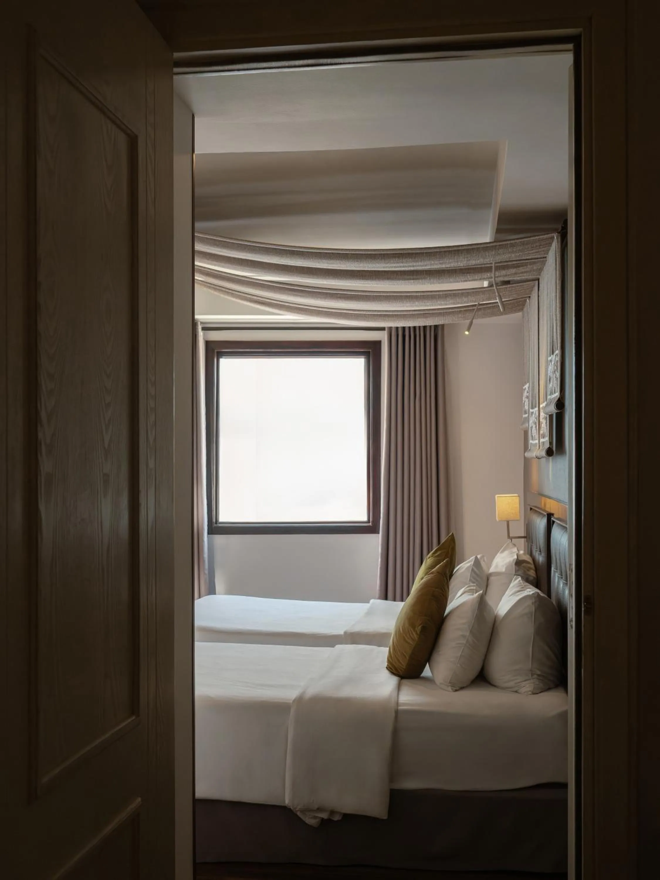 Bed in The Odys Boutique Hotel