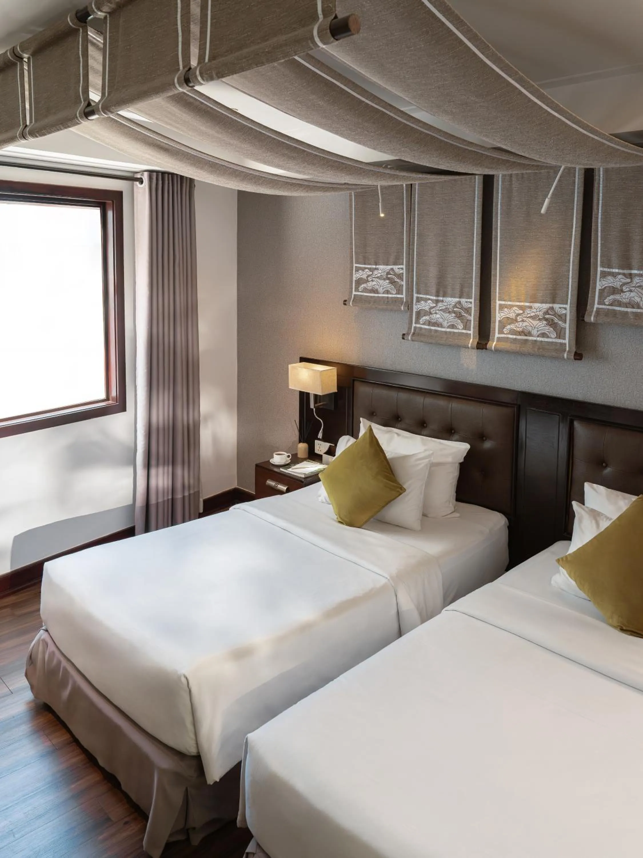 Bed in The Odys Boutique Hotel