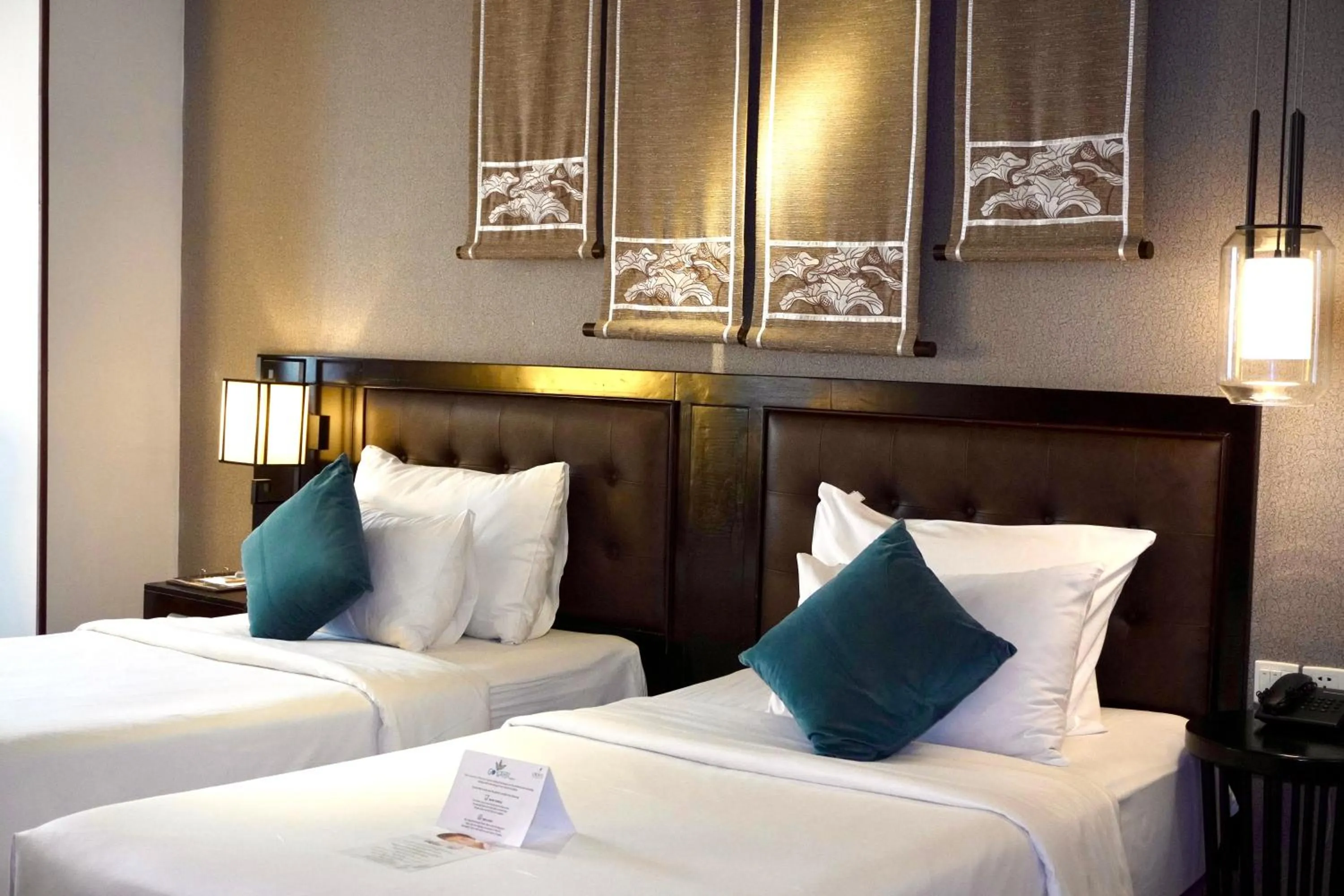 Bed in The Odys Boutique Hotel