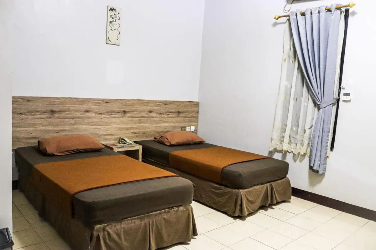 Bed in Hotel Pesona Merak