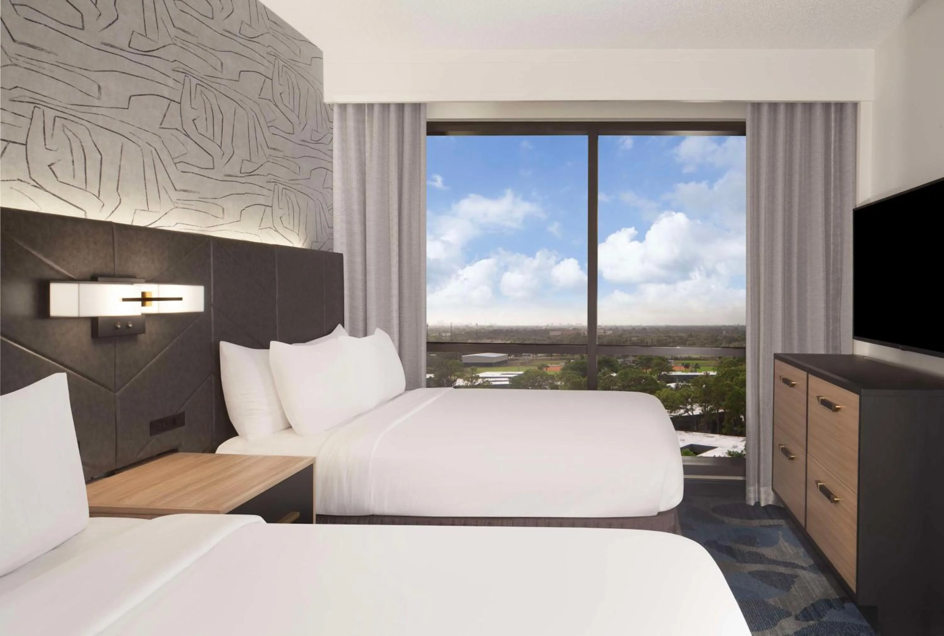 Bed in Embassy Suites by Hilton Palm Beach Gardens PGA Boulevard