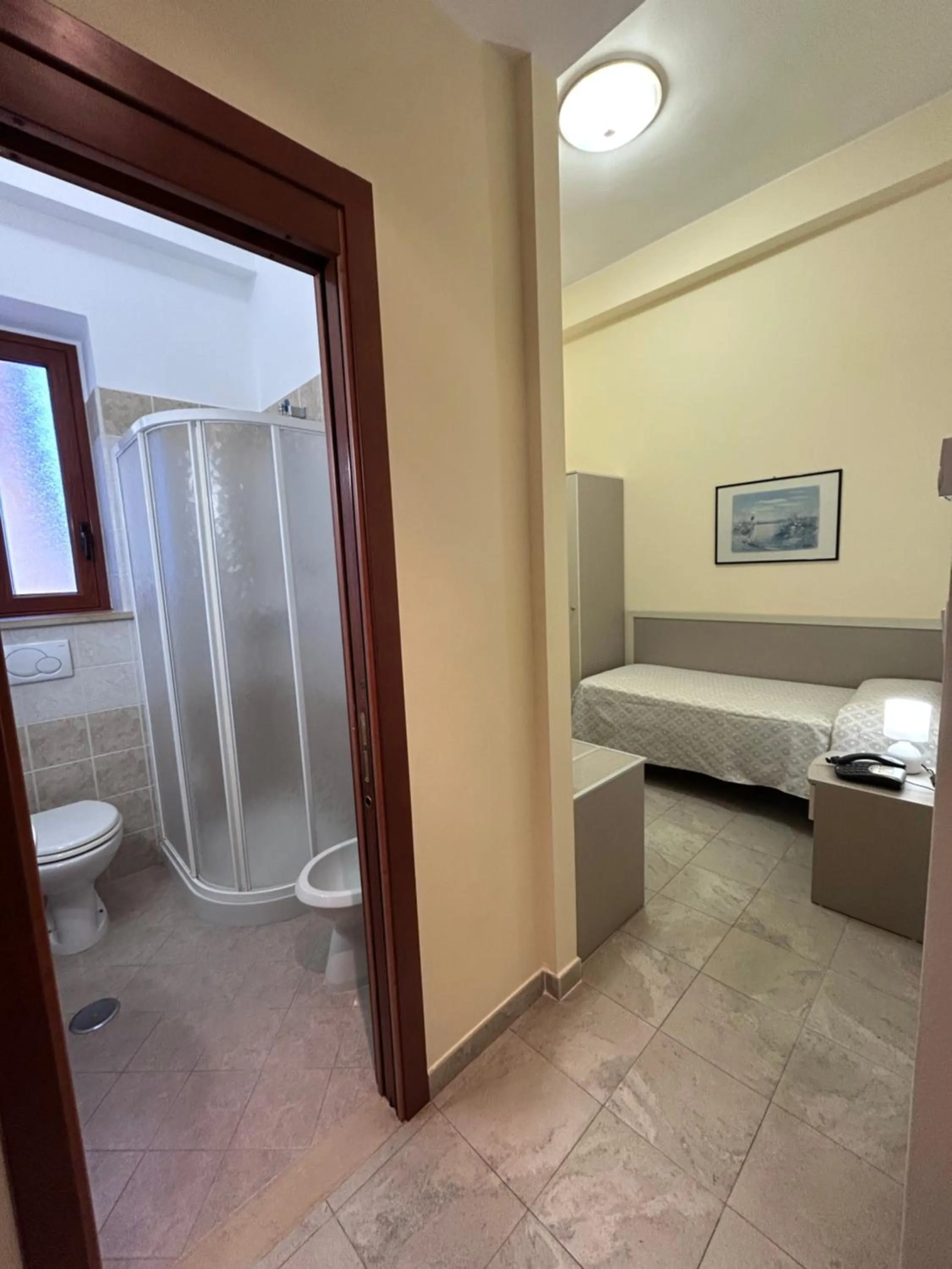 Bed in Il Nocchiero City Hotel