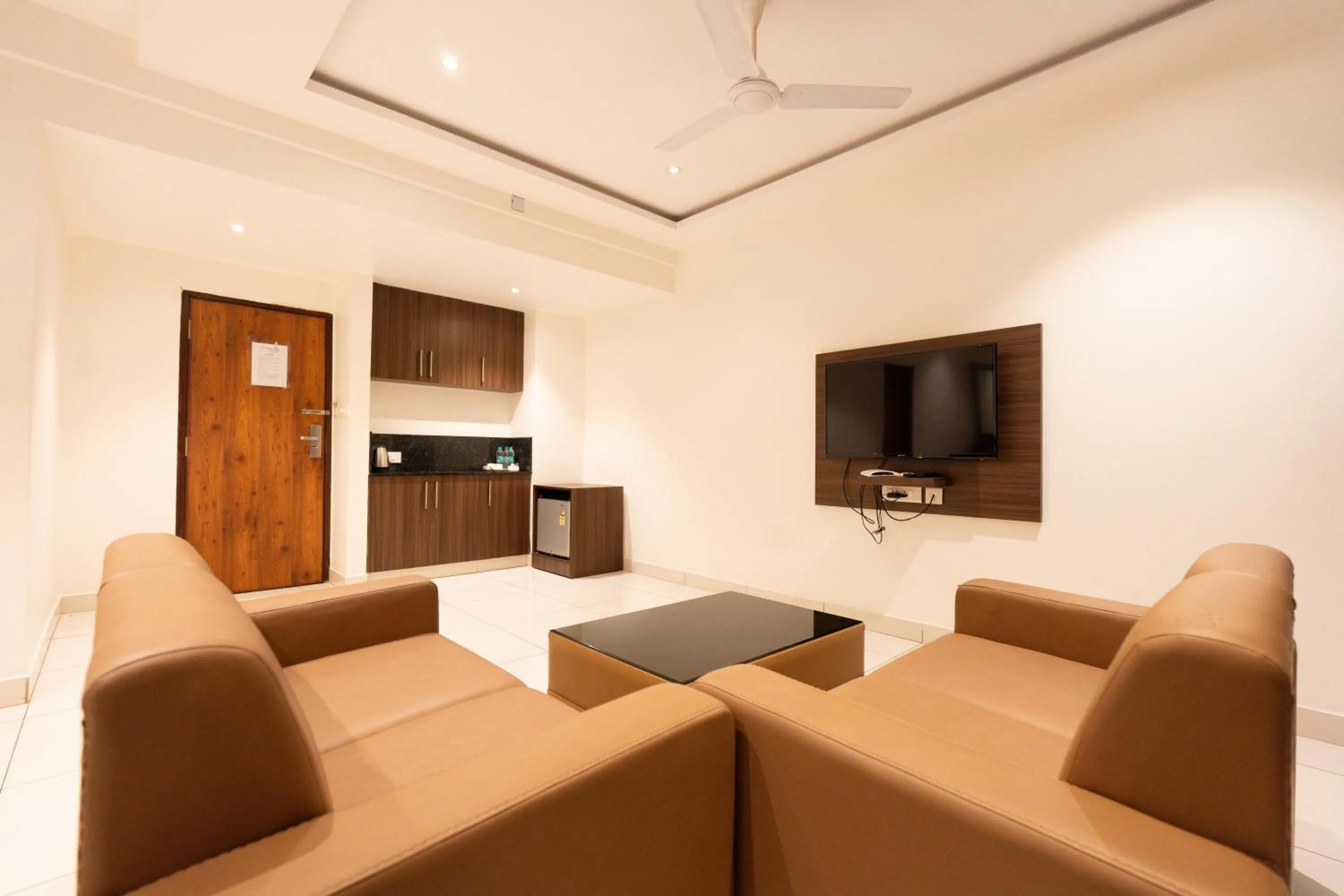 Communal lounge/ TV room in Hotel Karuna Residency