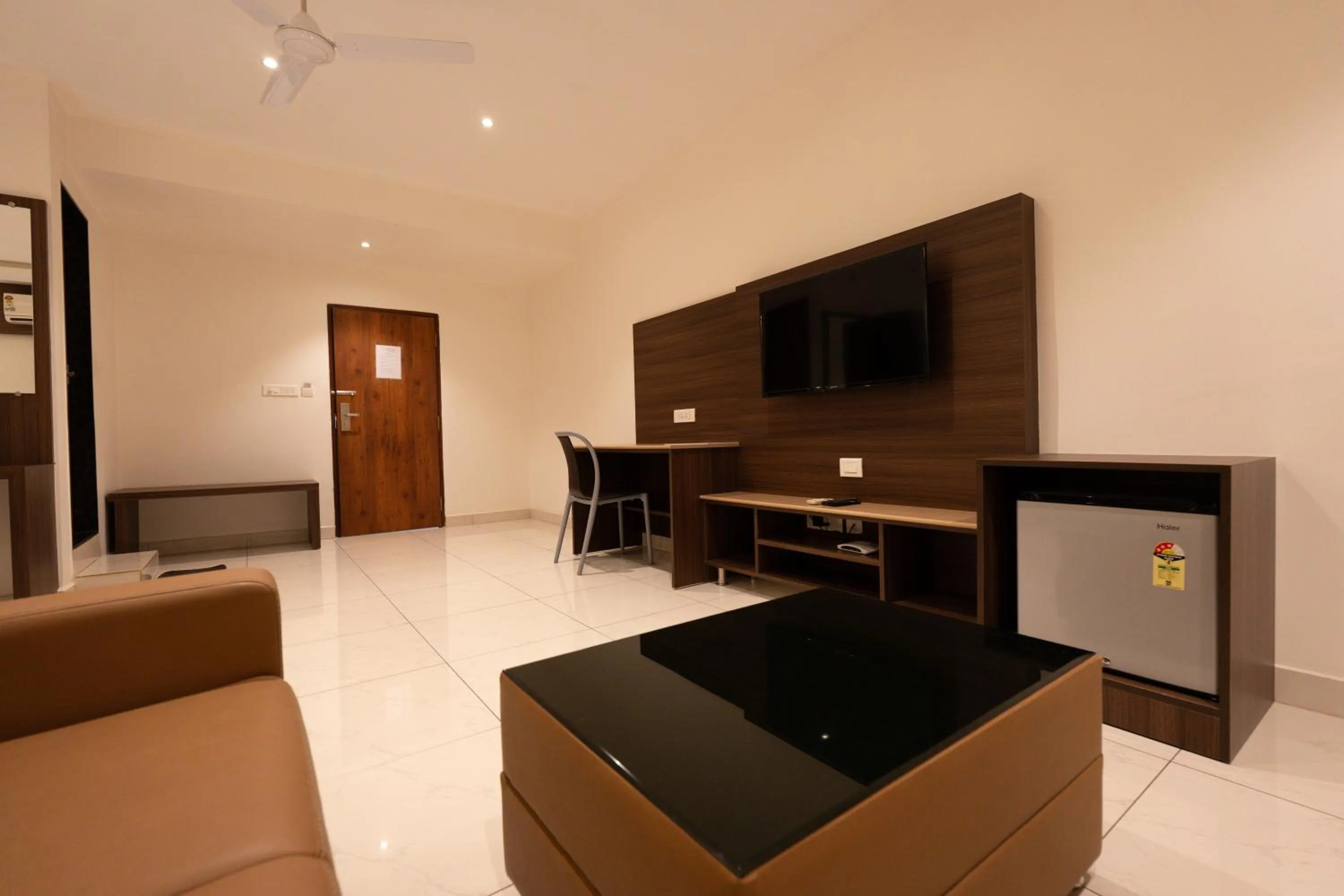 Communal lounge/ TV room in Hotel Karuna Residency