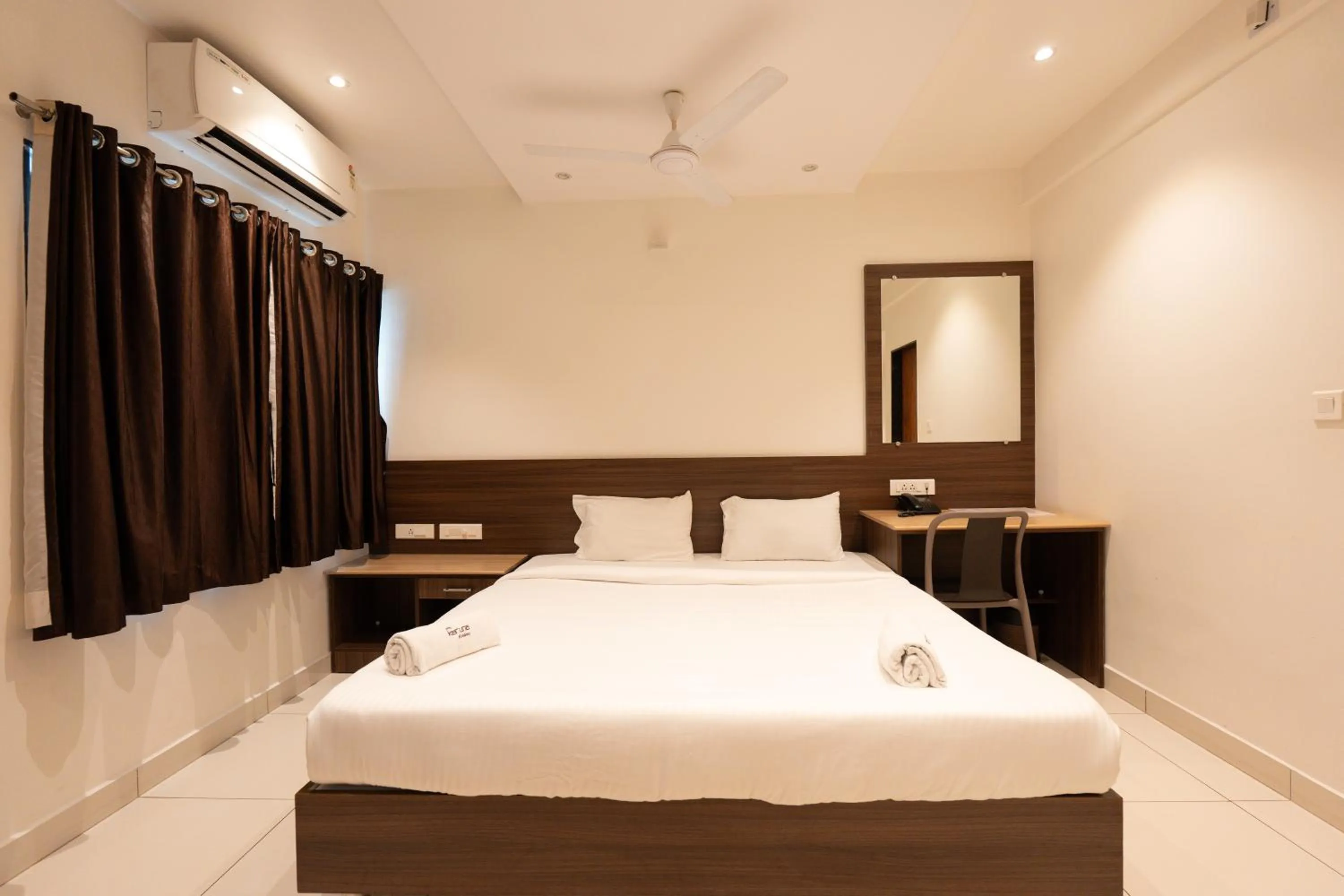 Bed in Hotel Karuna Residency