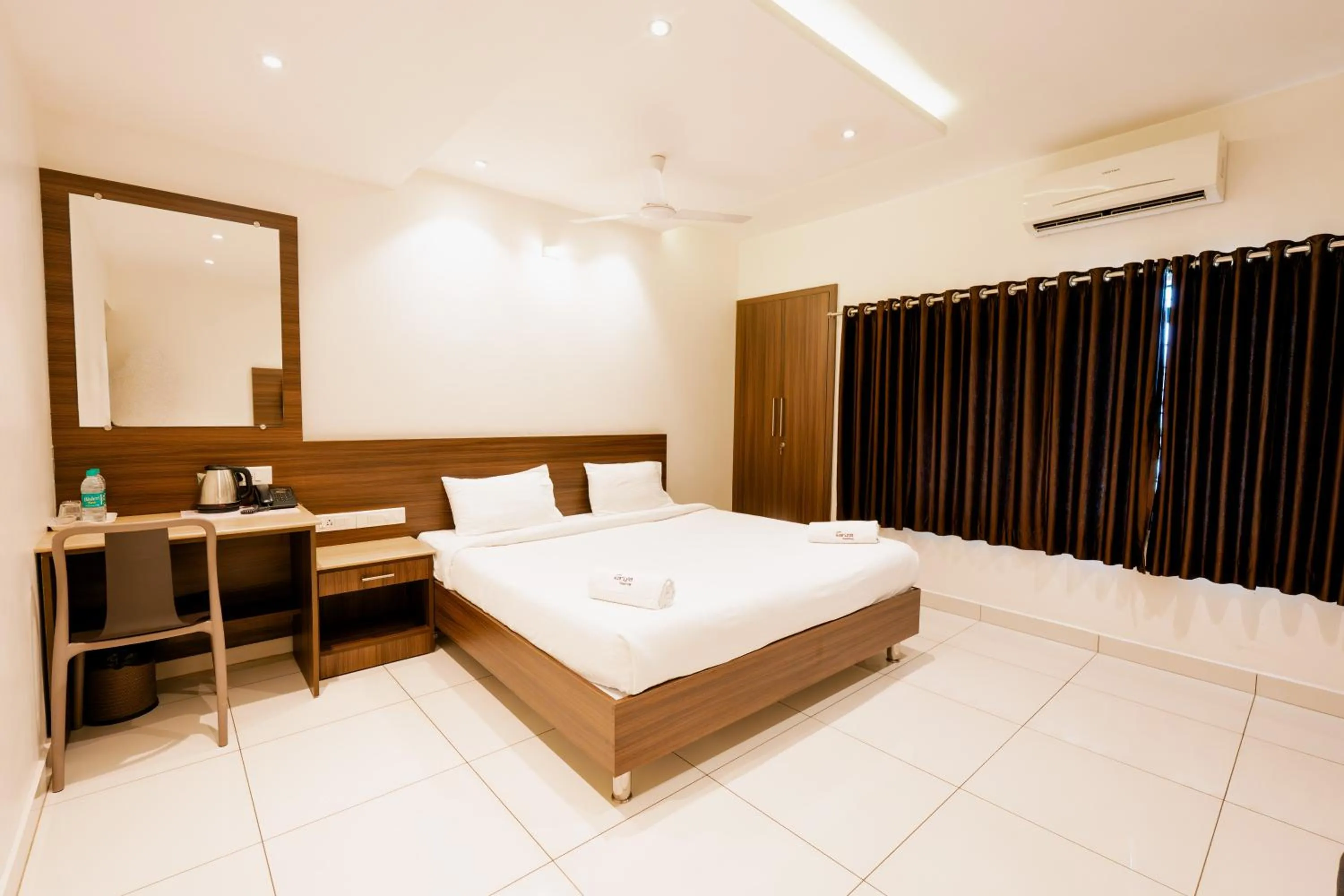 Bed in Hotel Karuna Residency