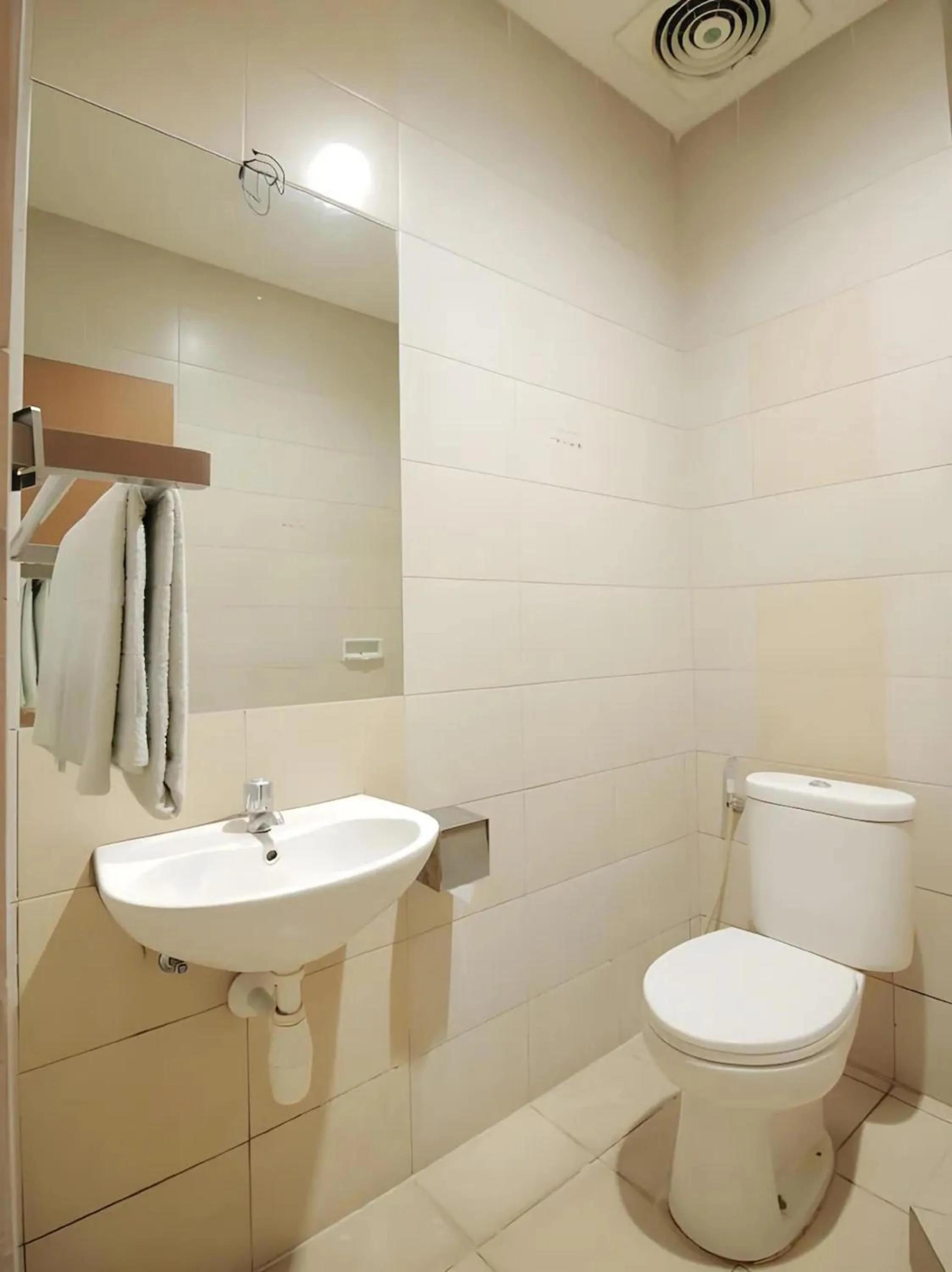 Bathroom in Capital O Galaxy Inn