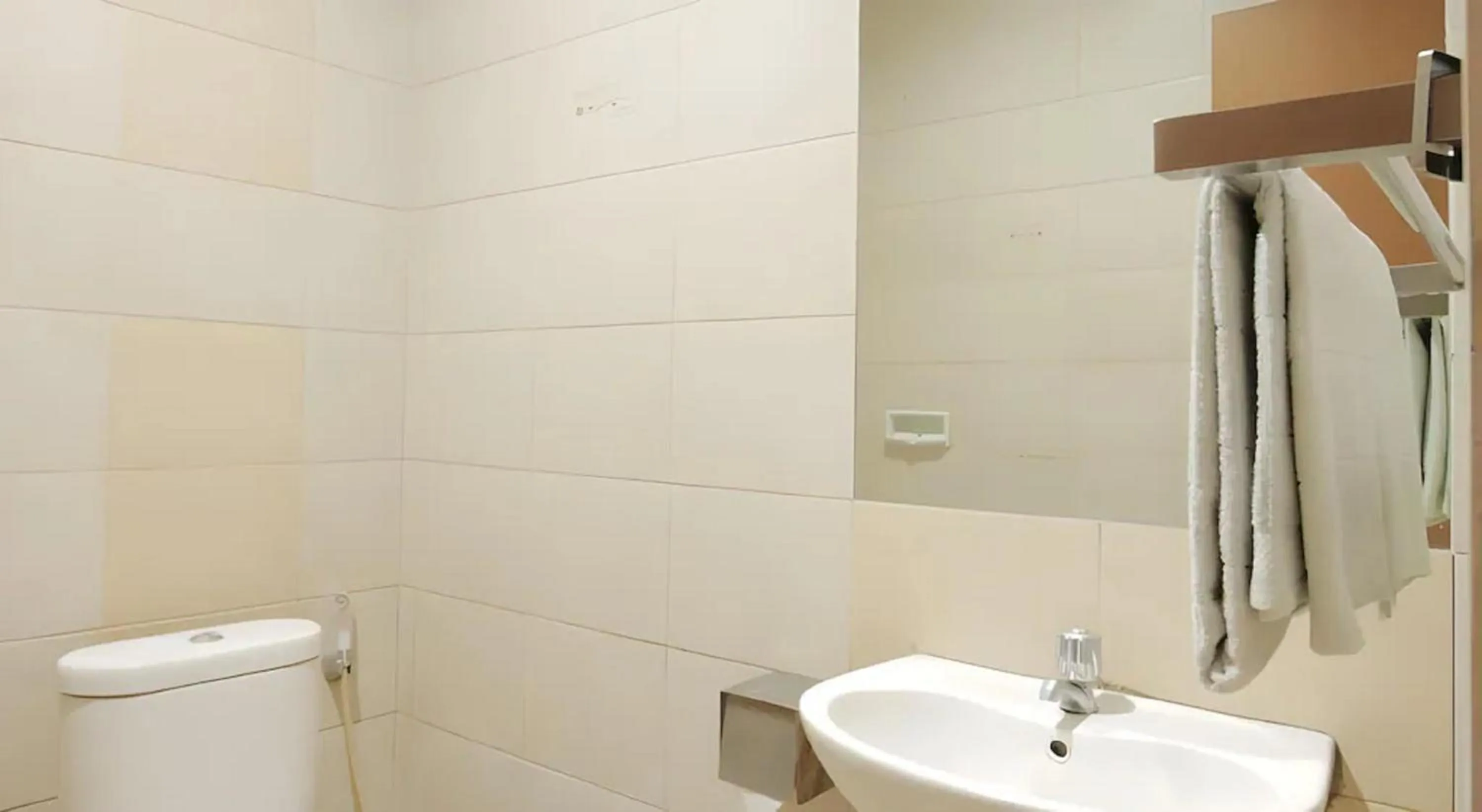 Bathroom in Capital O Galaxy Inn