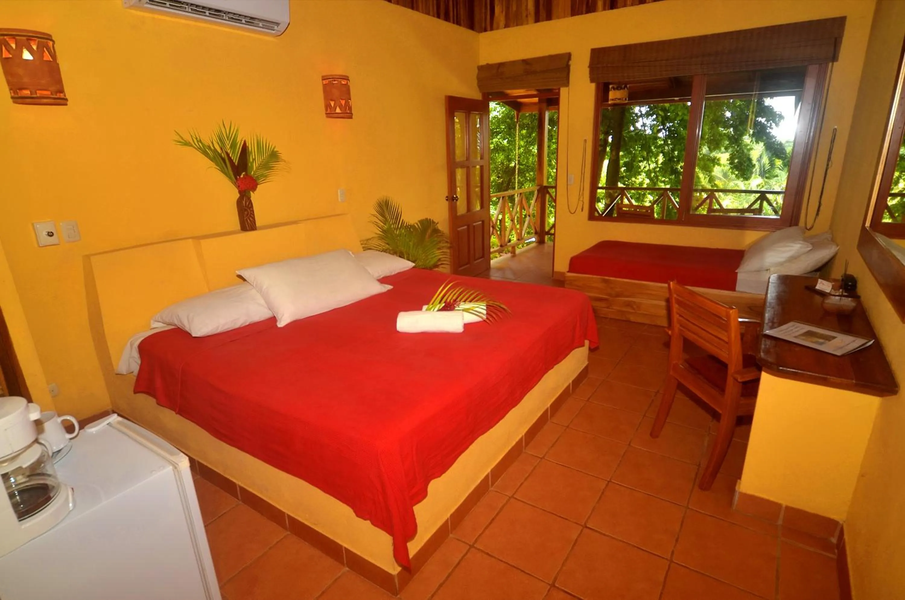 Bed in Esencia Hotel and Villas