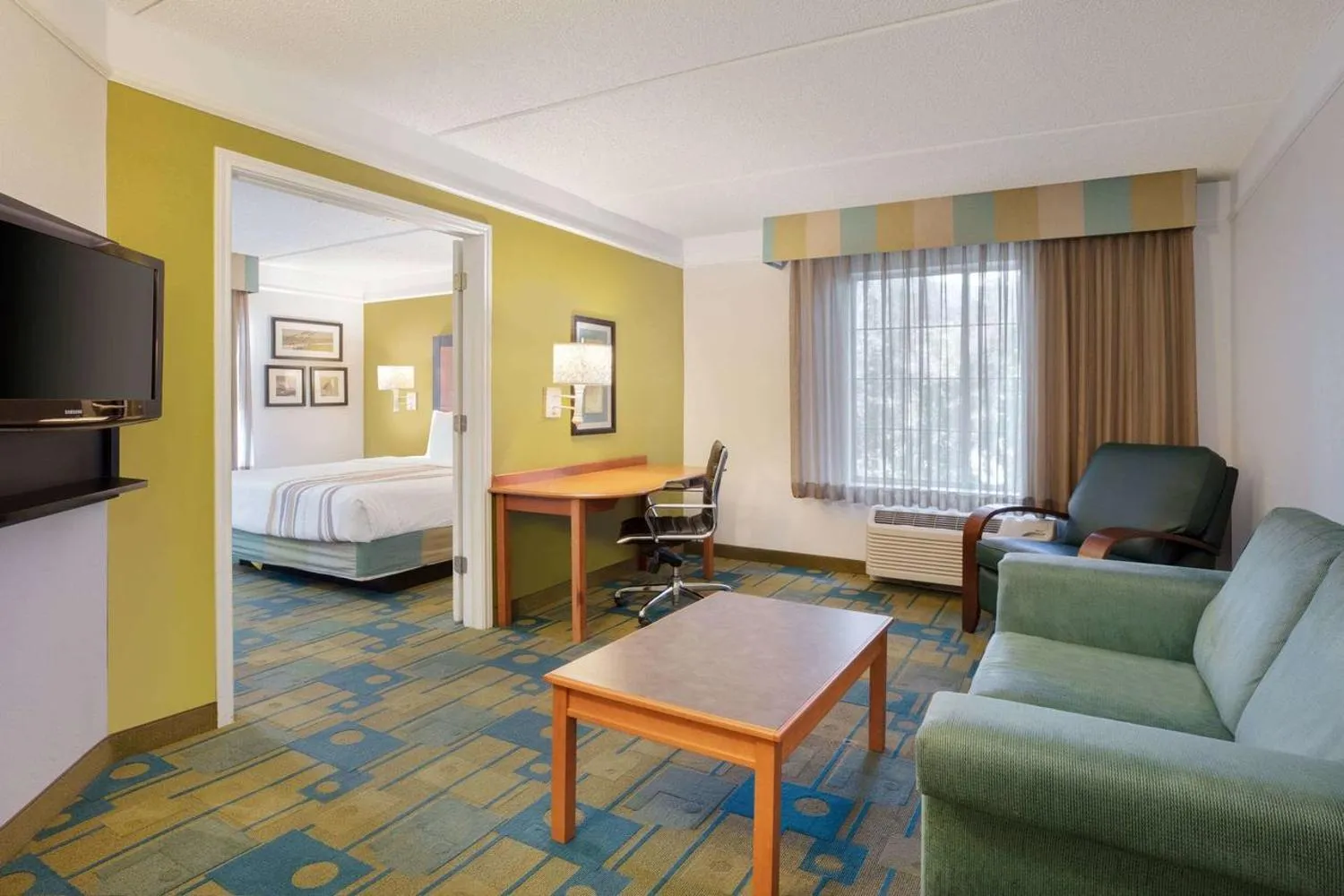 Bed in La Quinta Inn and Suites by Wyndham, Ocala