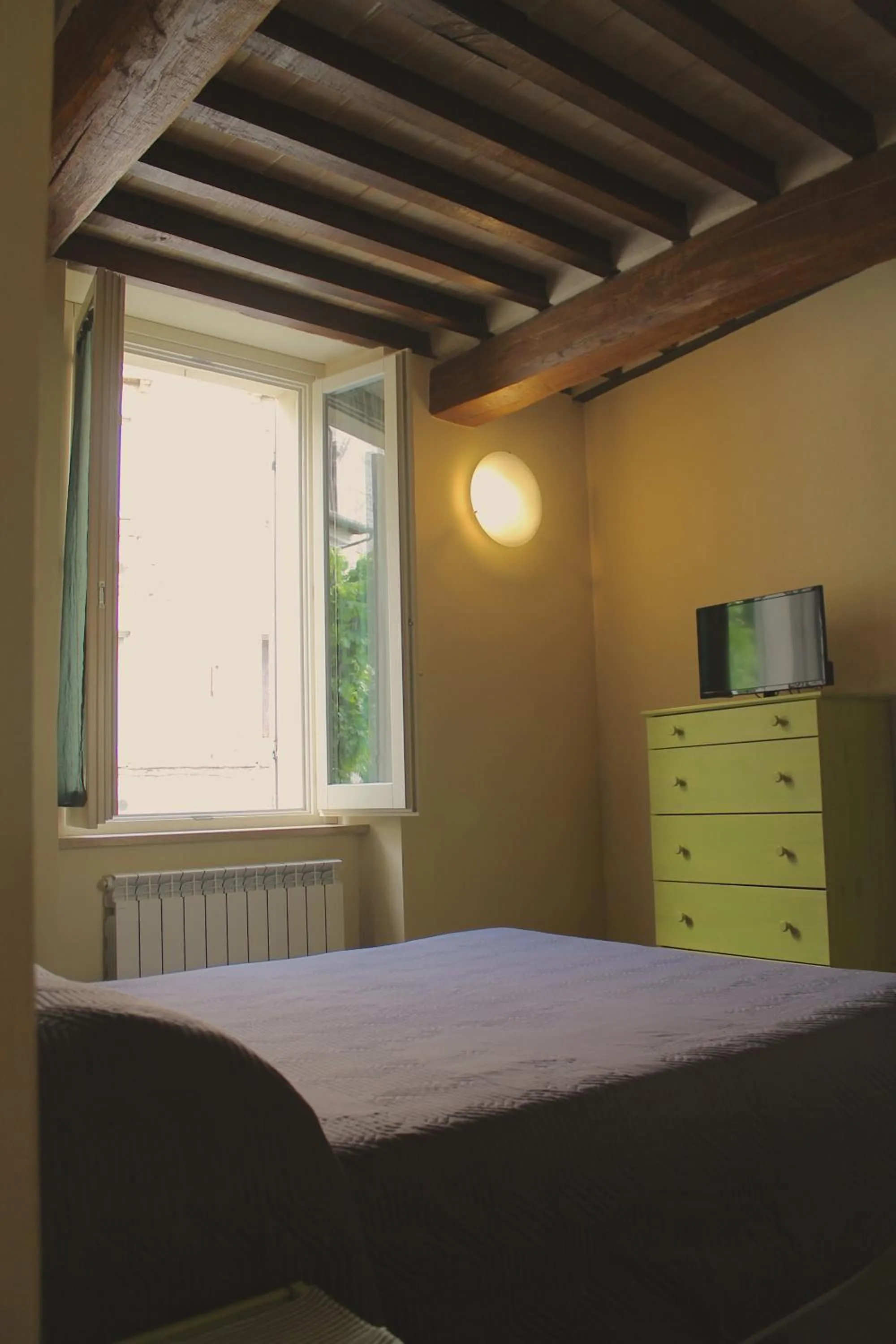 Bed in Alter Ego b&b Assisi