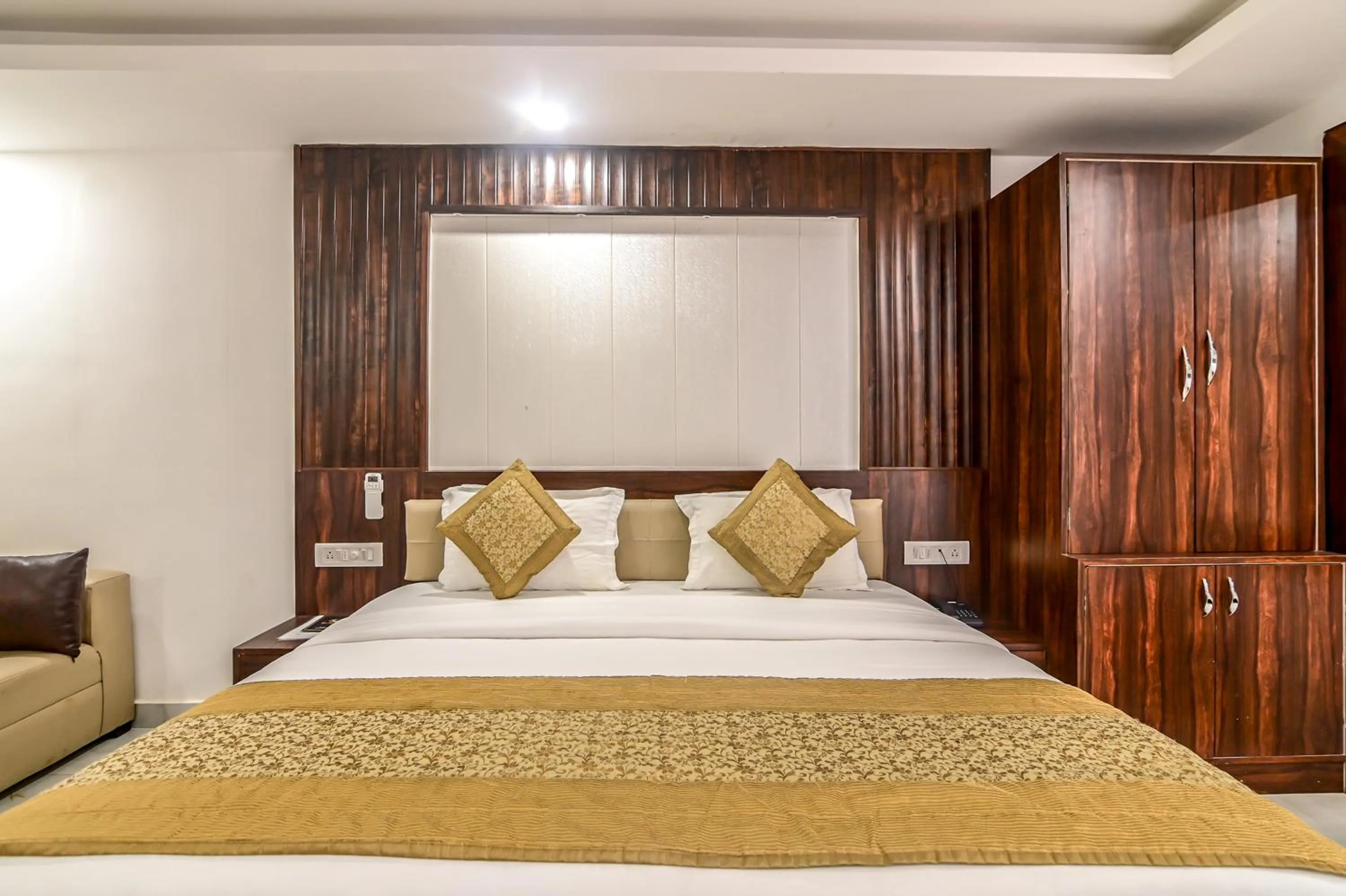 Bed in De Falcon Goa Beach Resort