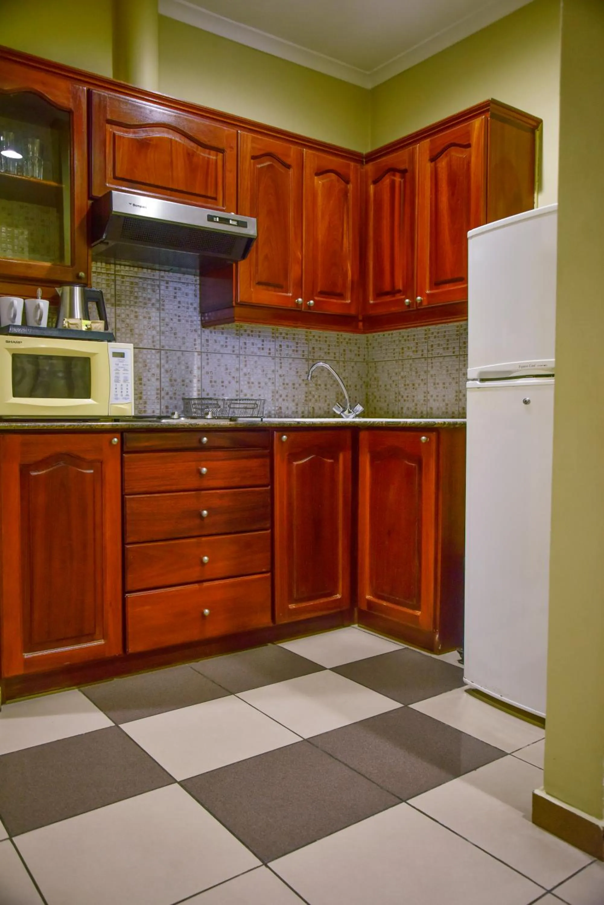 Kitchen or kitchenette in Harbour View Suites