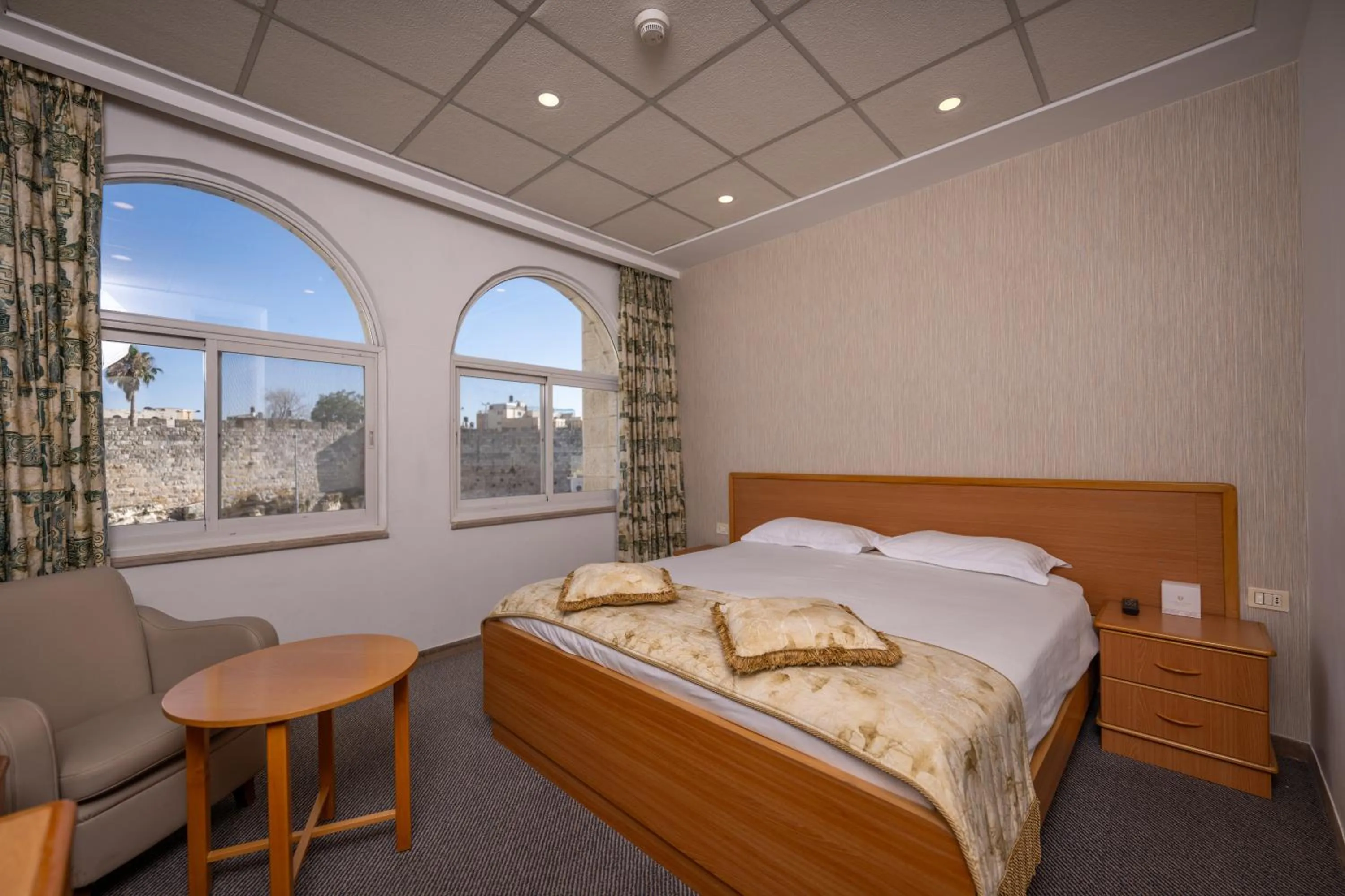 Bed in Golden Walls Hotel