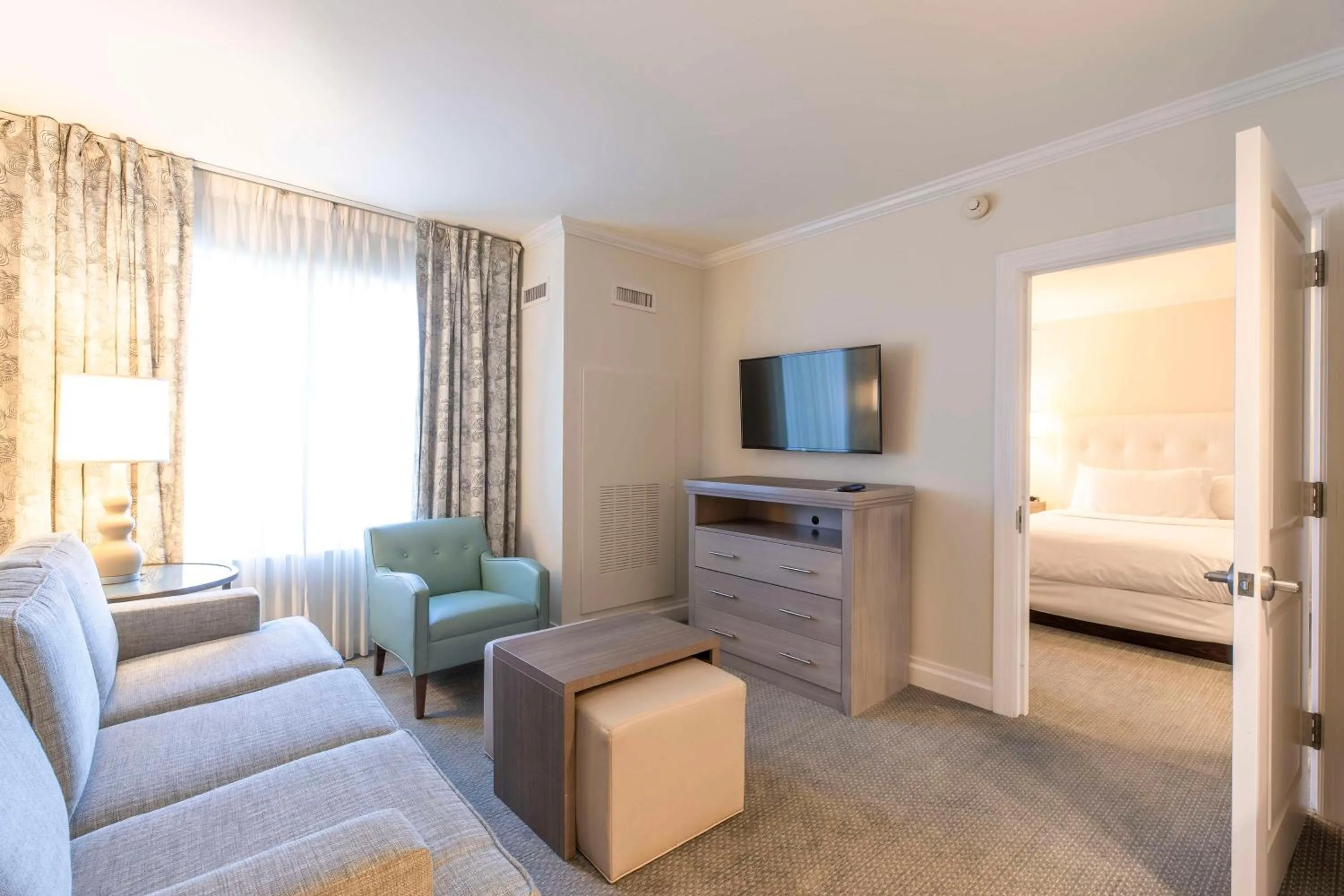 Living room, Bed in Homewood Suites by Hilton Palm Beach Gardens